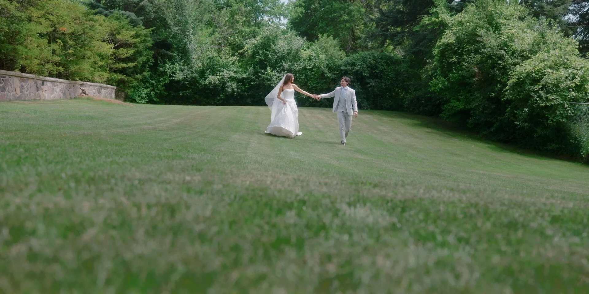 bride and groom walking holding hands
