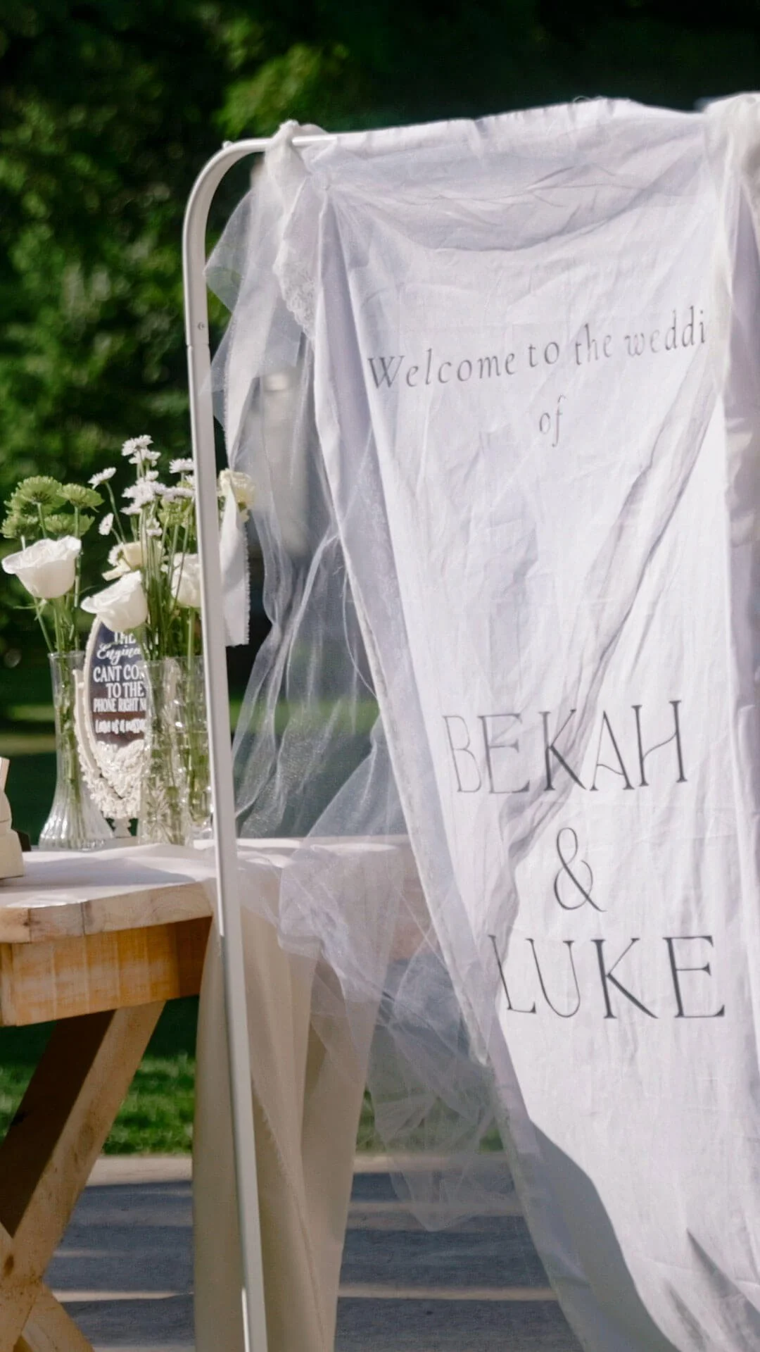 wedding sign saying "Welcome to the wedding of Bekah & Luke"