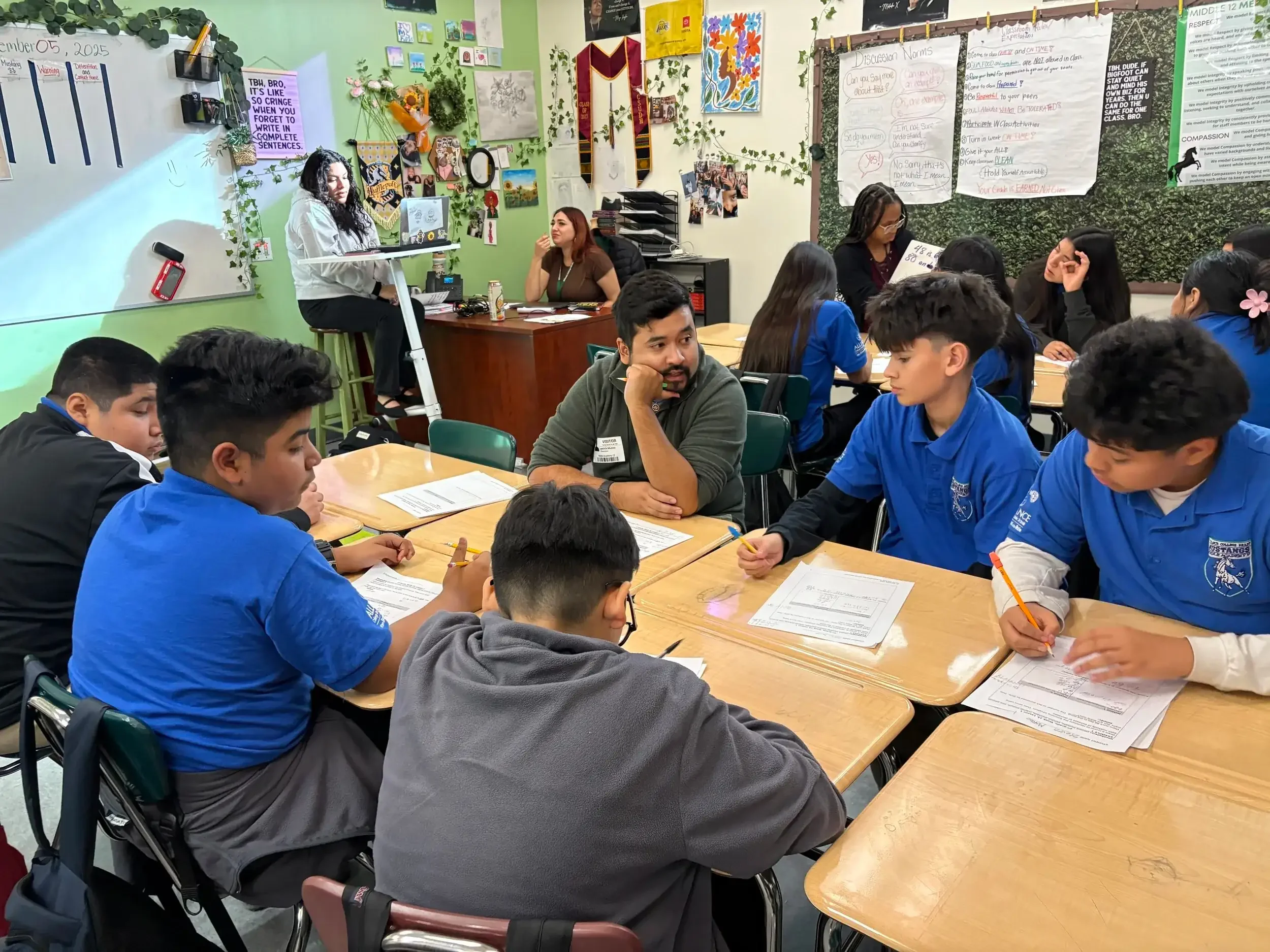K-12 students engaged in a small-group session with an in-person professional math tutor.