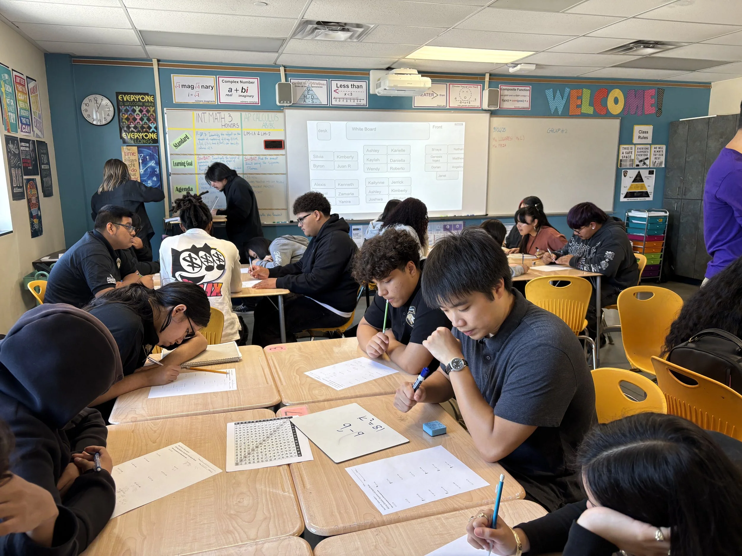 Tutor leading small-group math instruction in Los Angeles school.