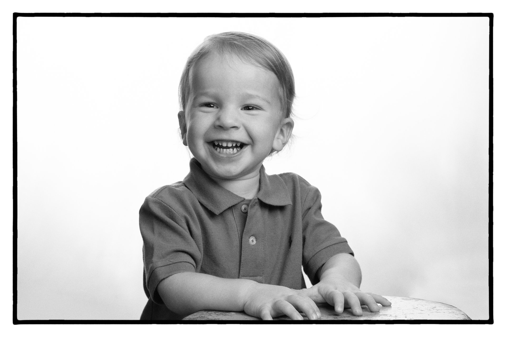 two year old boy looking at camera
