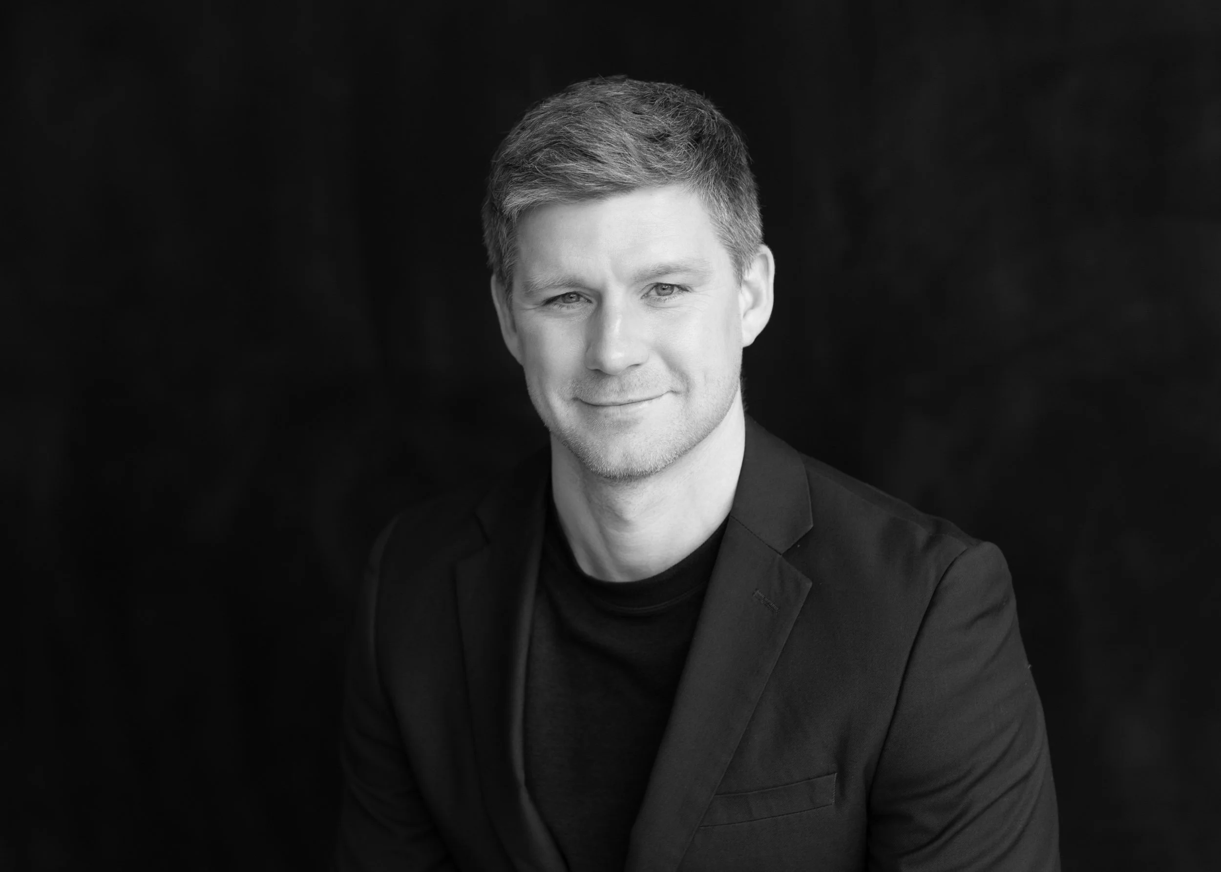 black & white headshot of male