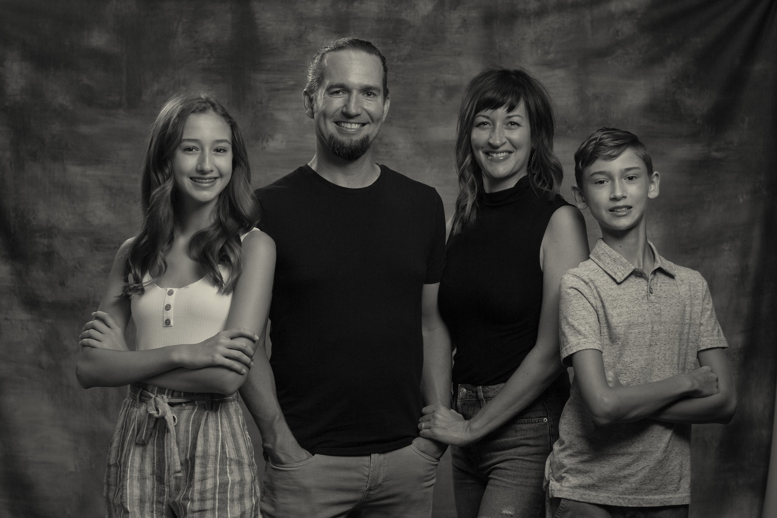 black and white portrait of a family of four