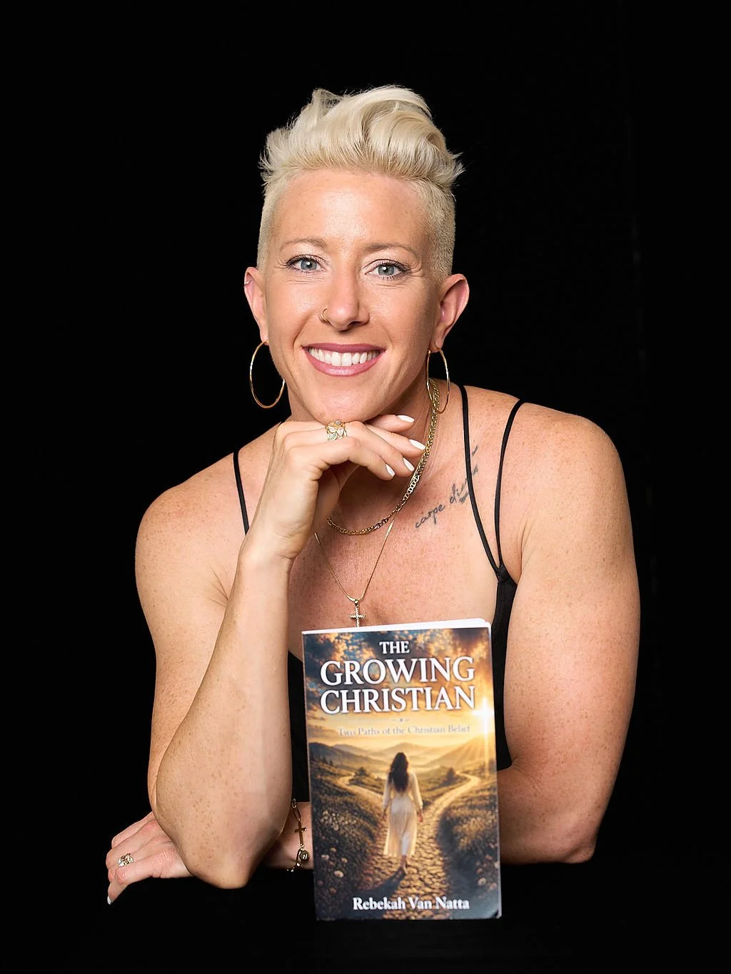 Rebekah Van Natta holding her book The Growing Christian