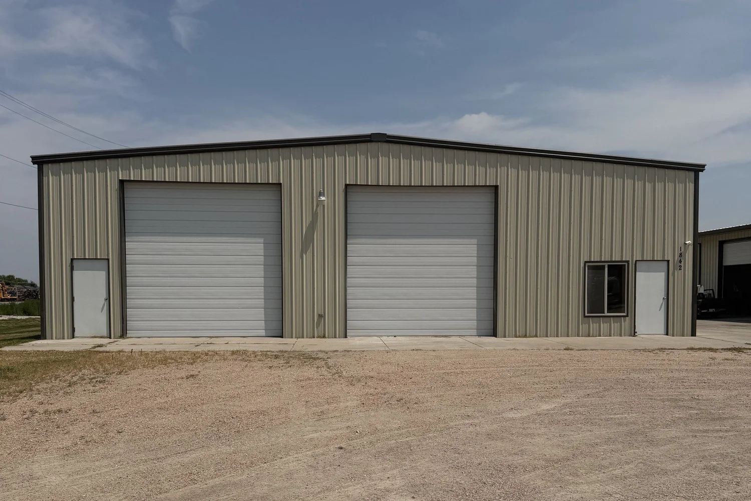 1842 W A St exterior with two overhead doors