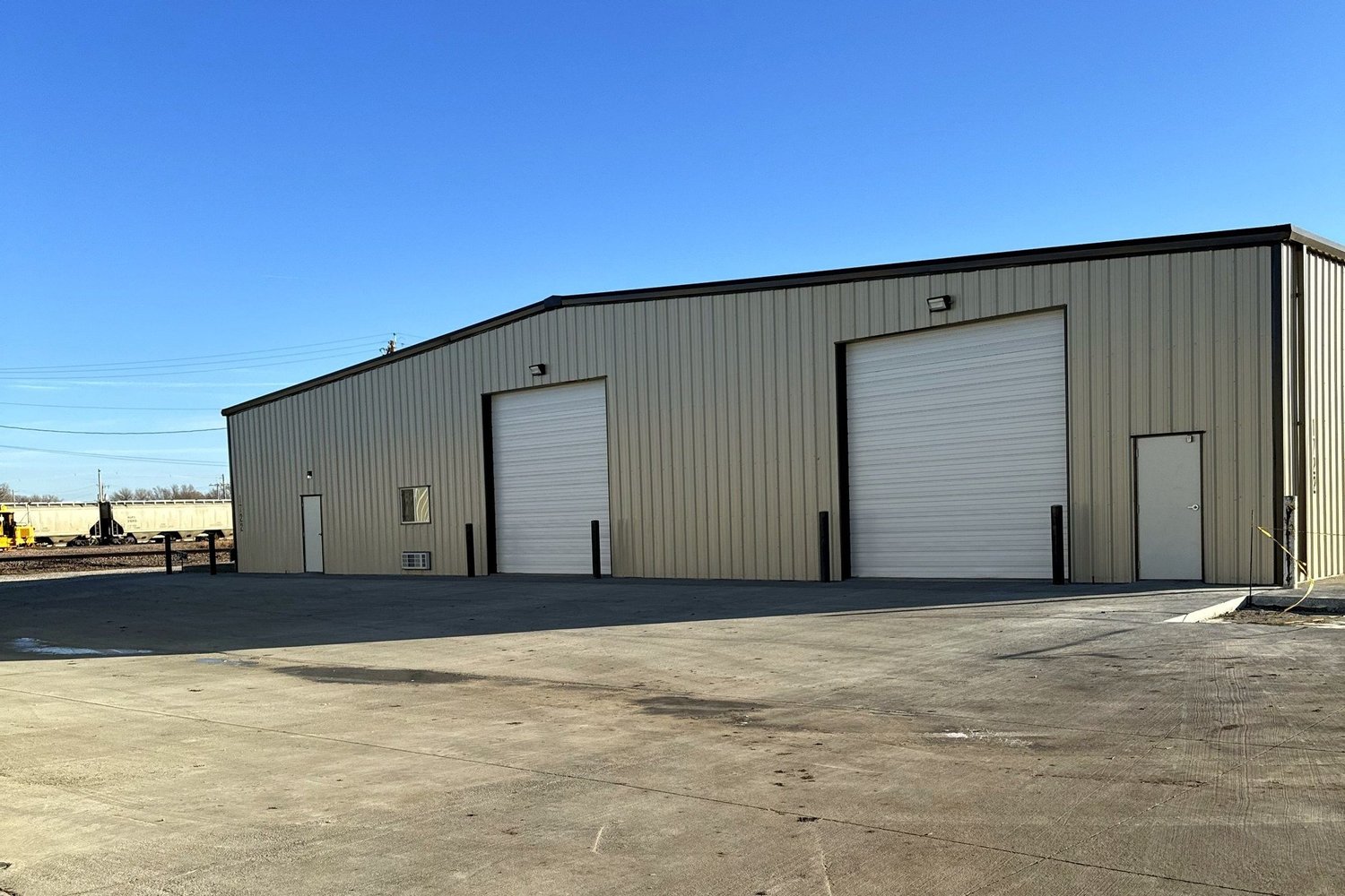 1722 W A St exterior with two grade-level drive-in doors