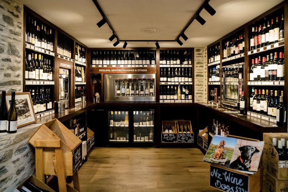 Wine cellar with chairs and stone wall
