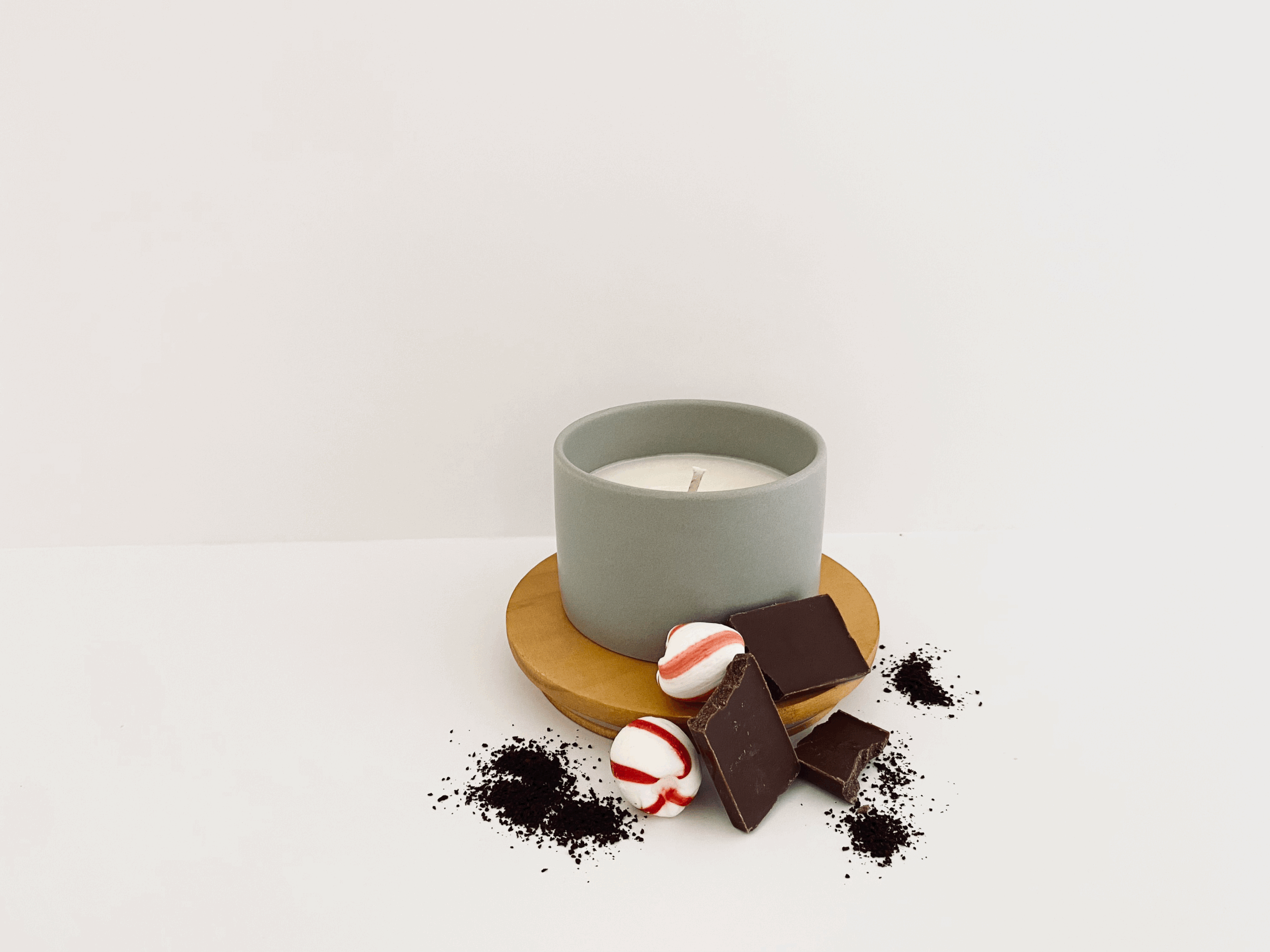 Winter Cheer scented candle in gray vessel.gif