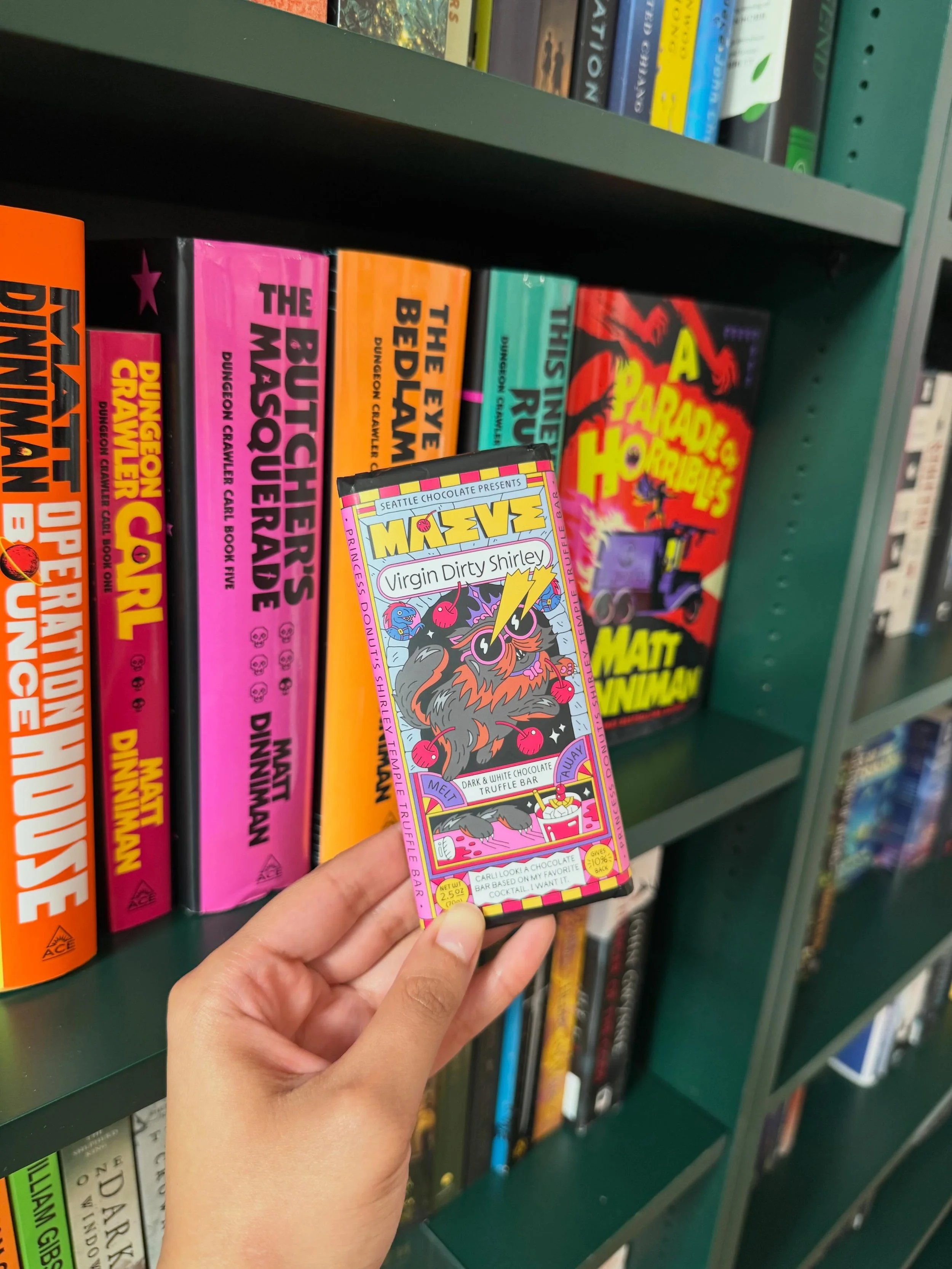 New chocolate bars have landed in the shop! Including this awesome #DungeonCrawlerCarl themed bar featuring #PrincessDonut &lsquo;s beverage of choice. 😘🐈&zwj;⬛📚✨👑🍩