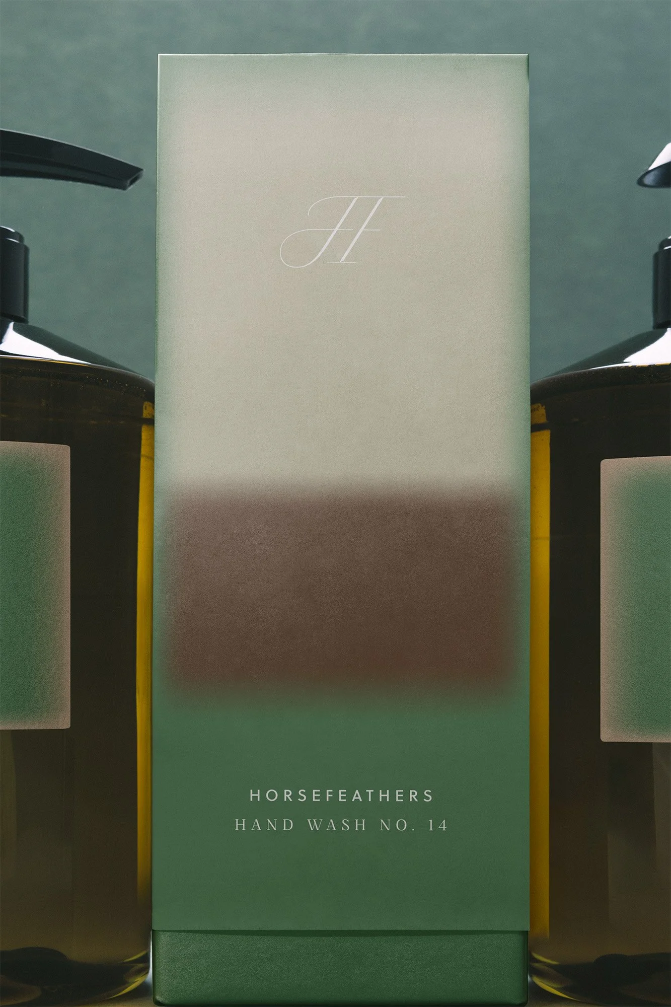 A green box labeled 'Horsefeathers Hand Wash No. 14' flanked by bottles of hand wash.