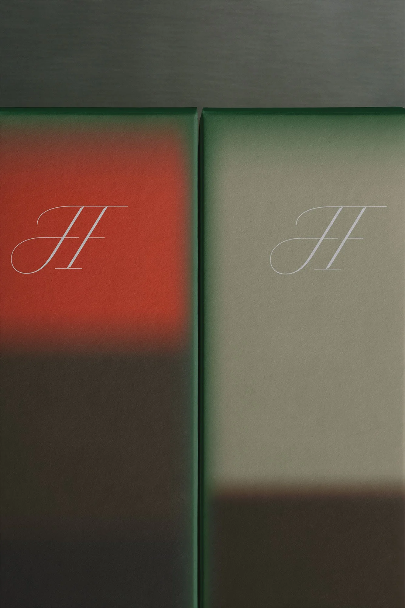 Two colored boxes, one orange and one beige, with the letter 'H' written on each in a cursive font.