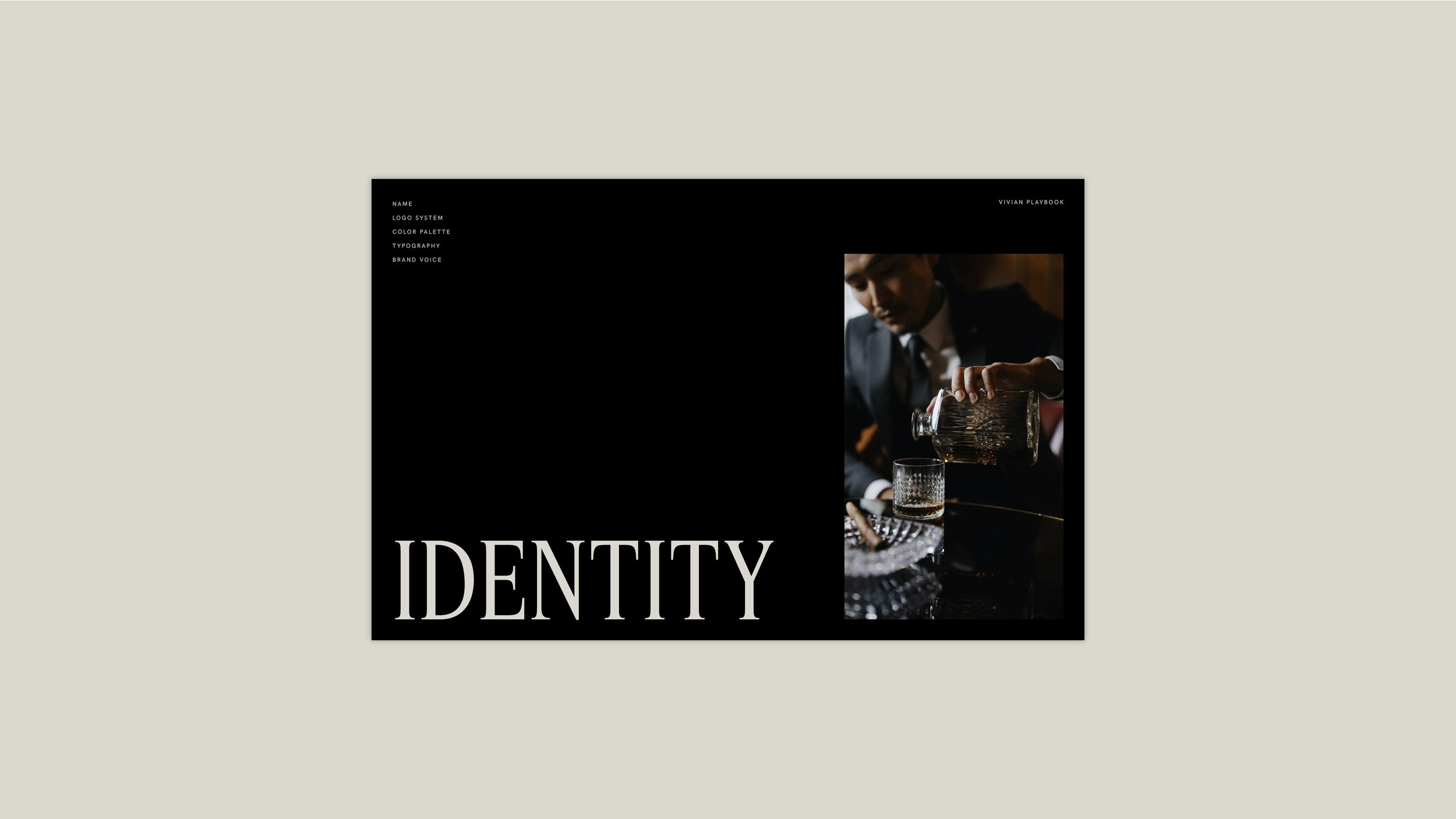 A magazine cover titled 'IDENTITY' featuring a man in a suit pouring a drink, with a sleek black background and a vertical photo of the man on the right side.