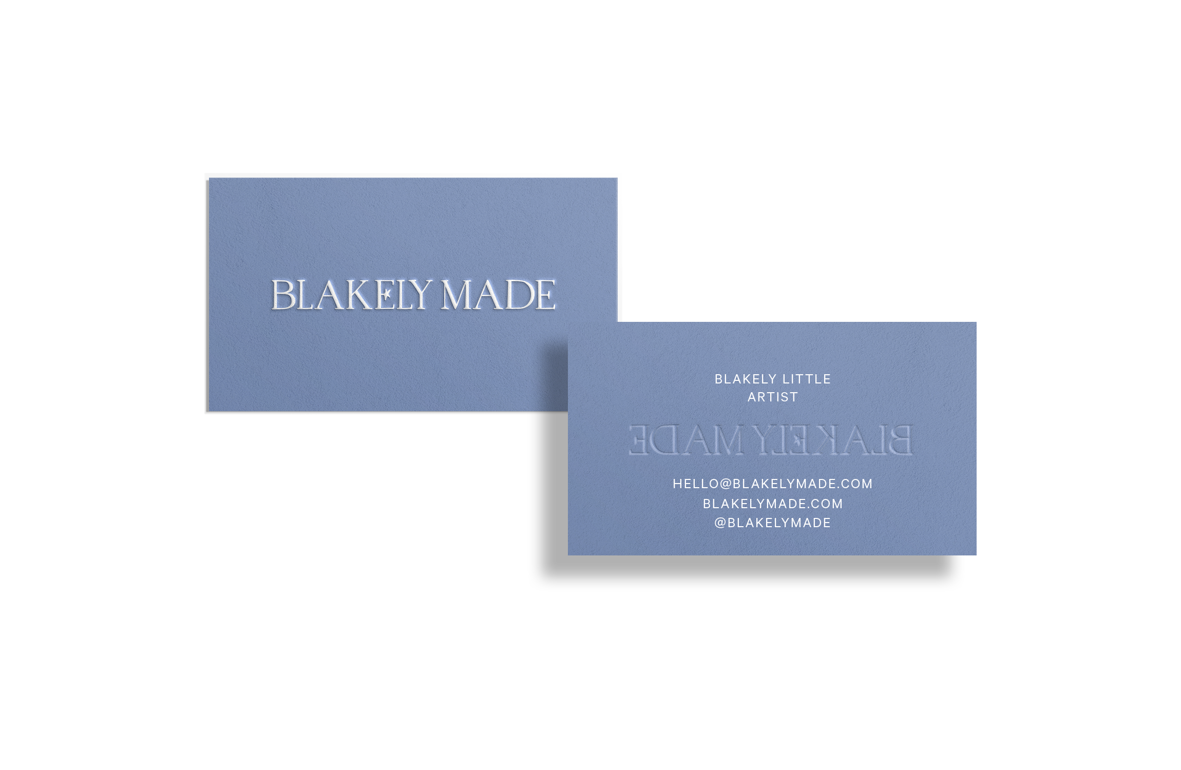 Business cards for Blakely Made, a little artist. One card shows the company name, the other displays contact information including email, website, and Instagram handle, all in light blue textured background.