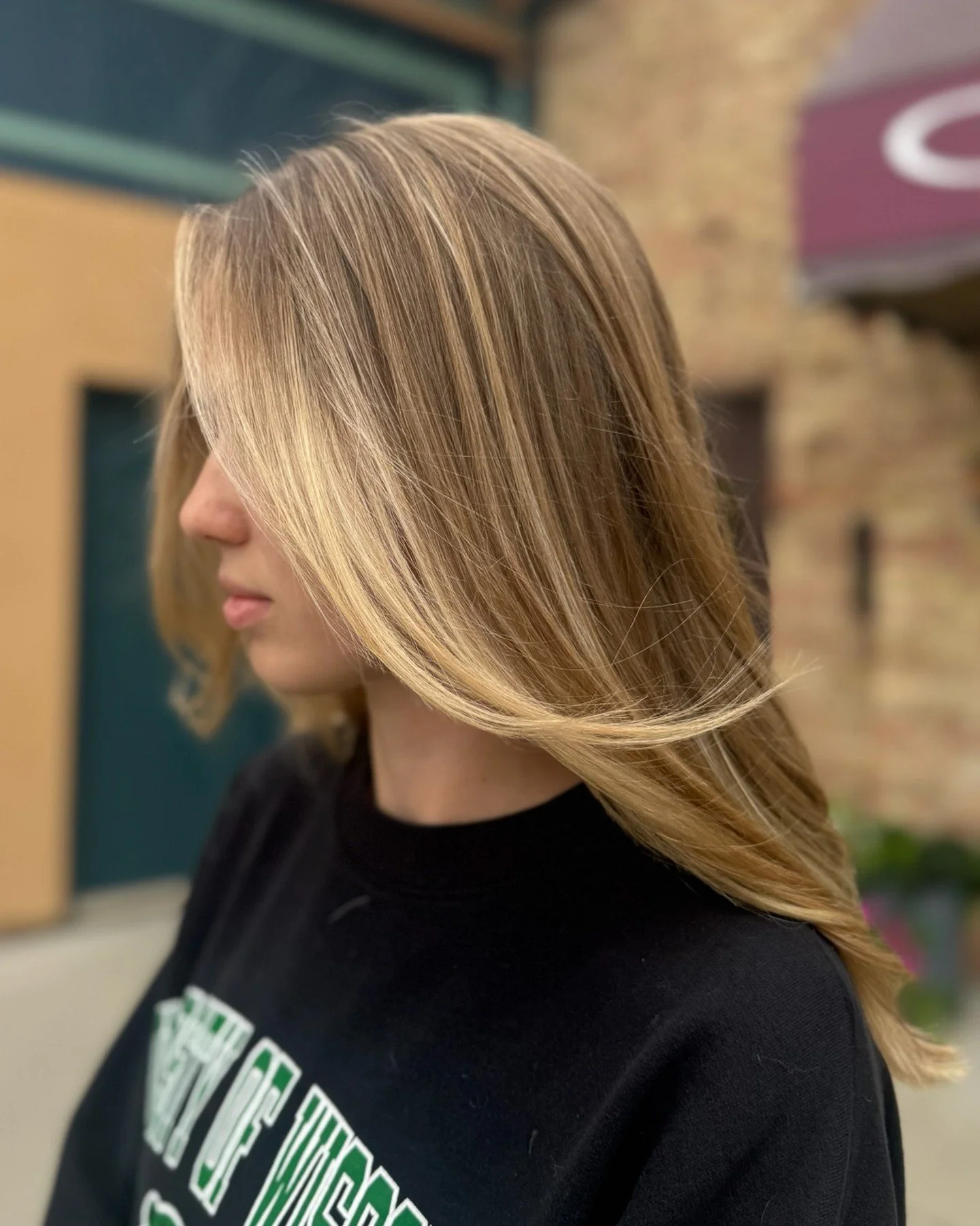 Carmela created this soft balayage by brightening her natural tone and blending light pieces through the mids and around the face. The color stays warm, dimensional, and easy to maintain, and the movement in the cut helps everything fall in a really 