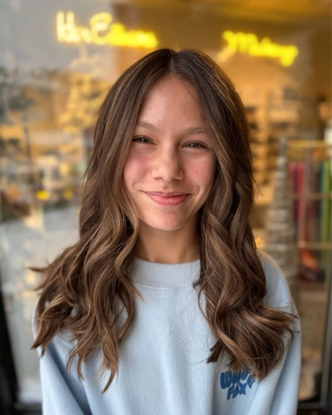 Soft, seamless dimension with movement that feels natural and effortless. This balayage was designed to enhance her base color, add warmth, and grow out beautifully over time. Finished with loose waves to show off the blend and shine.

Balayage by Ca