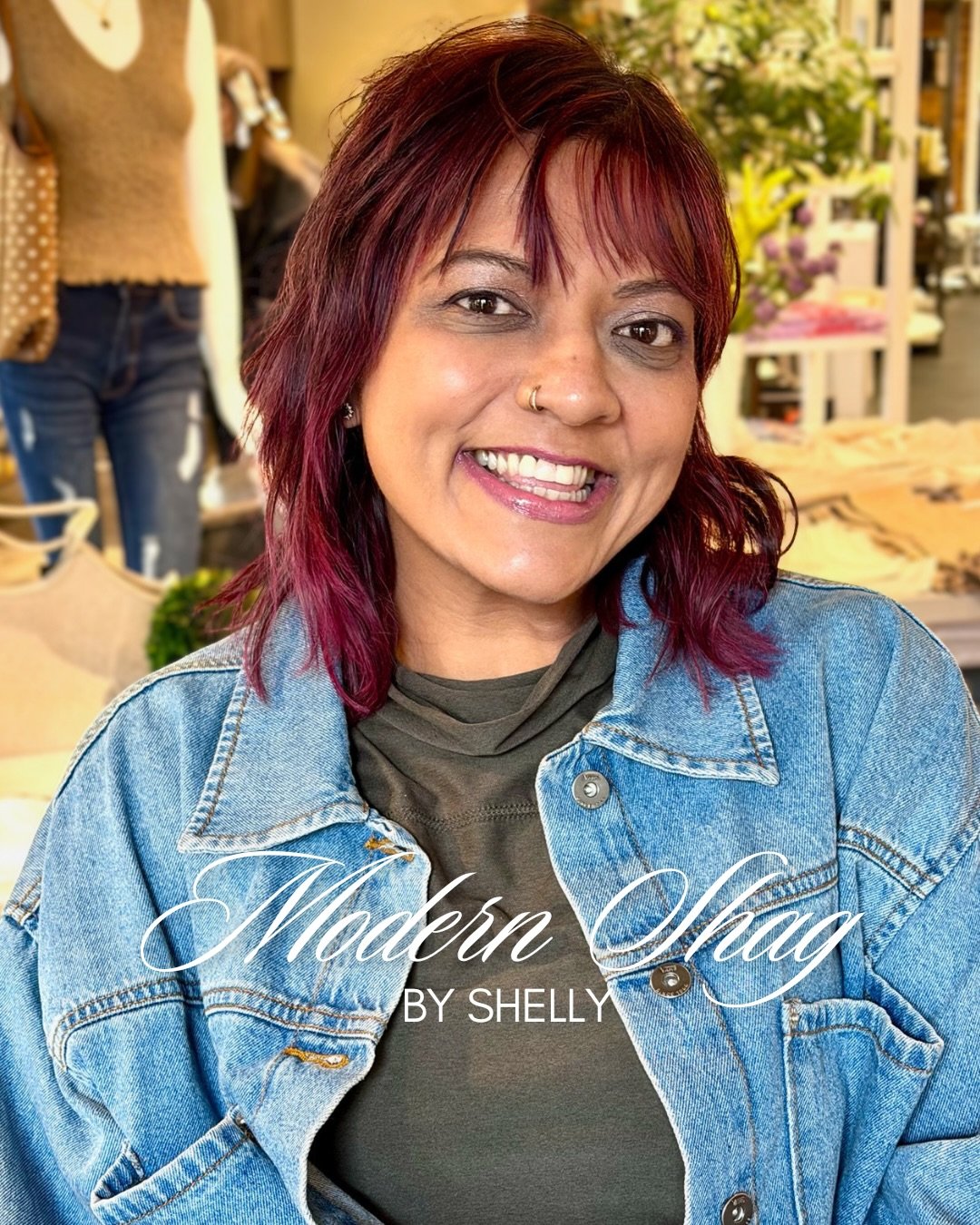 The shag is back, and Shandy is wearing it like she invented it.

Shelly cut a modern shag with soft choppy layers around the face, a wispy fringe, and plenty of lived-in movement. The cherry-red color catches the light and somehow looks even better 