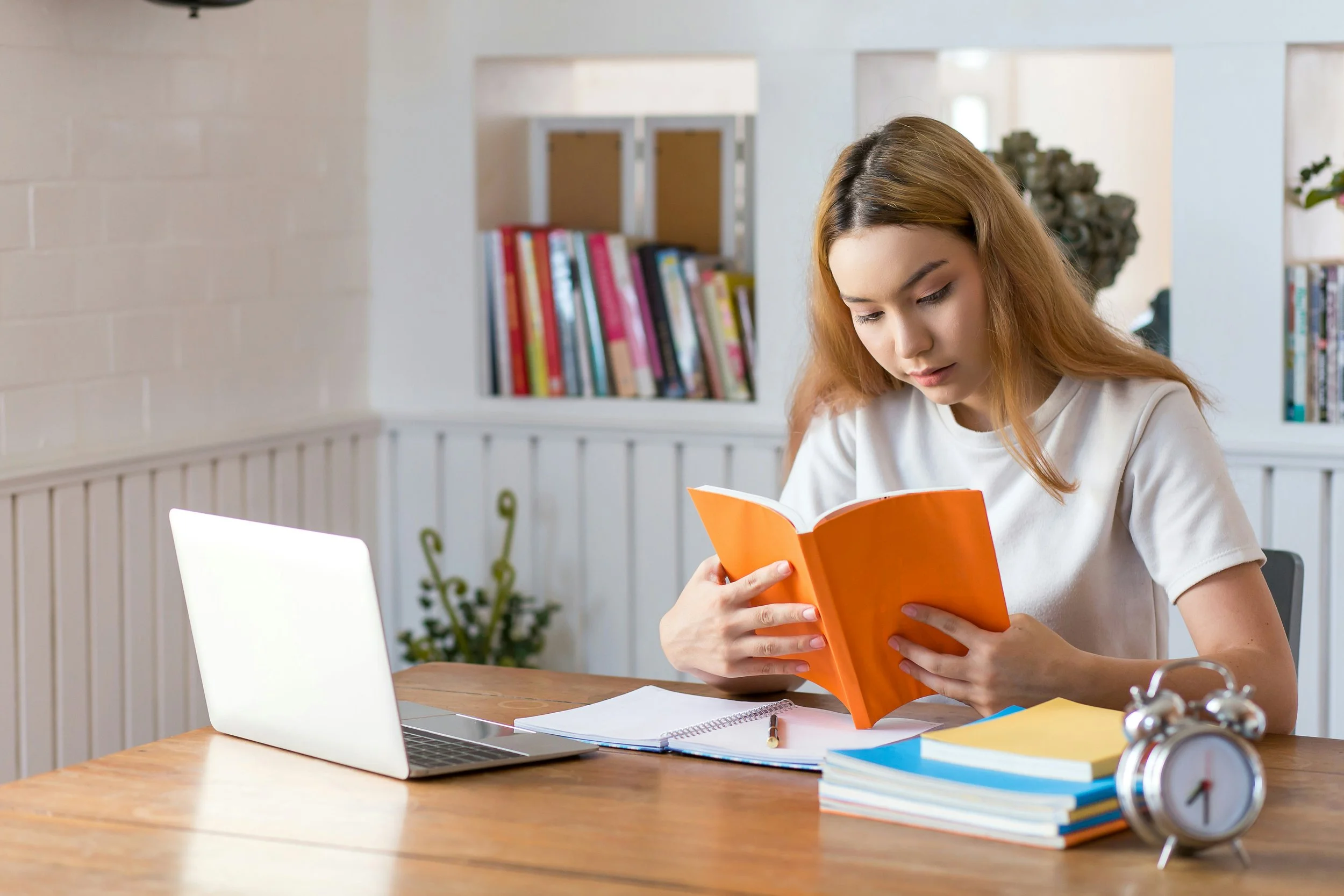 Graduate counseling student preparing for therapy school while studying clinical skills, practicum expectations, therapist training, and mental health education