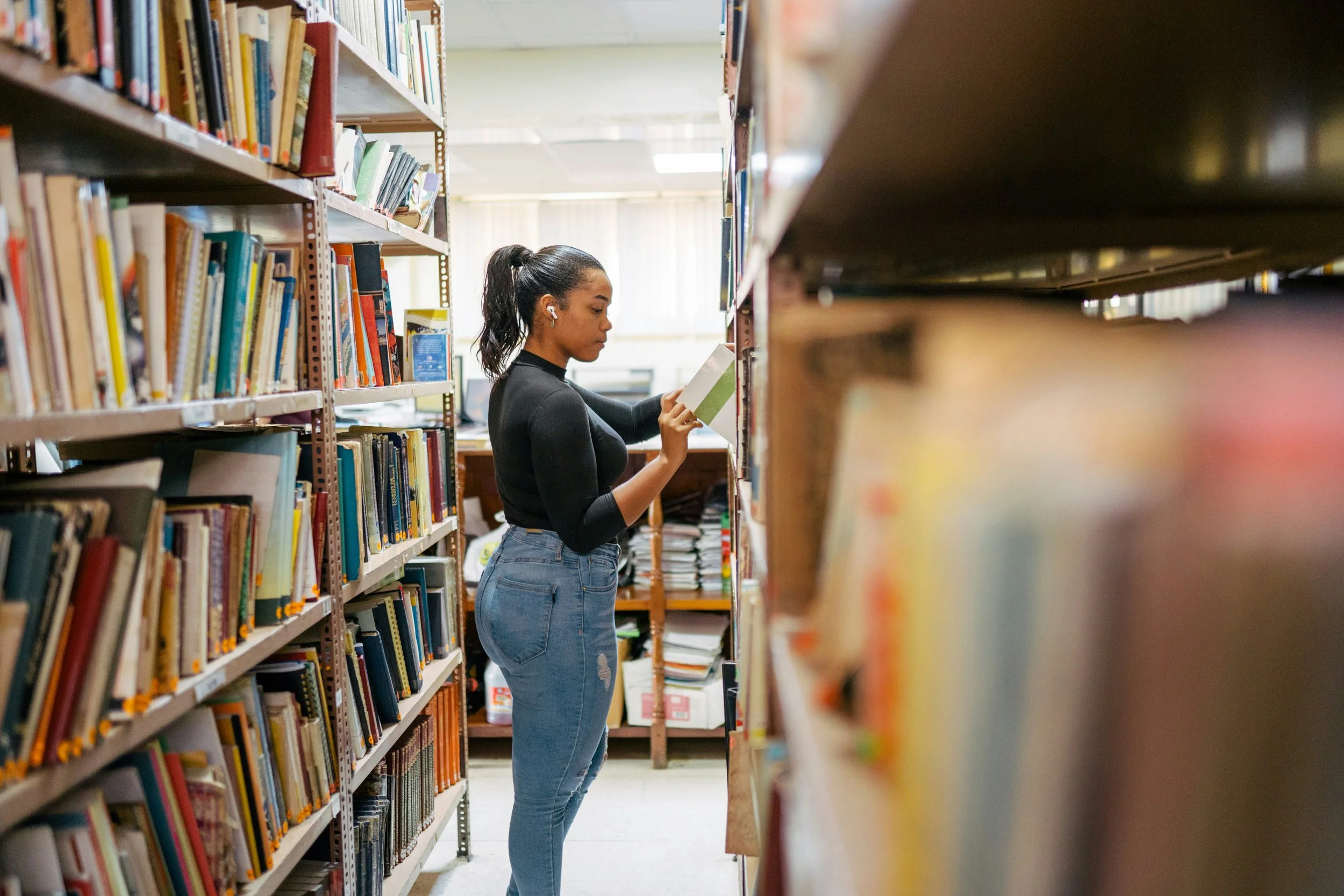 Graduate counseling student studying with textbooks and notes, representing the first year of graduate school in counseling and the journey to becoming a therapist.