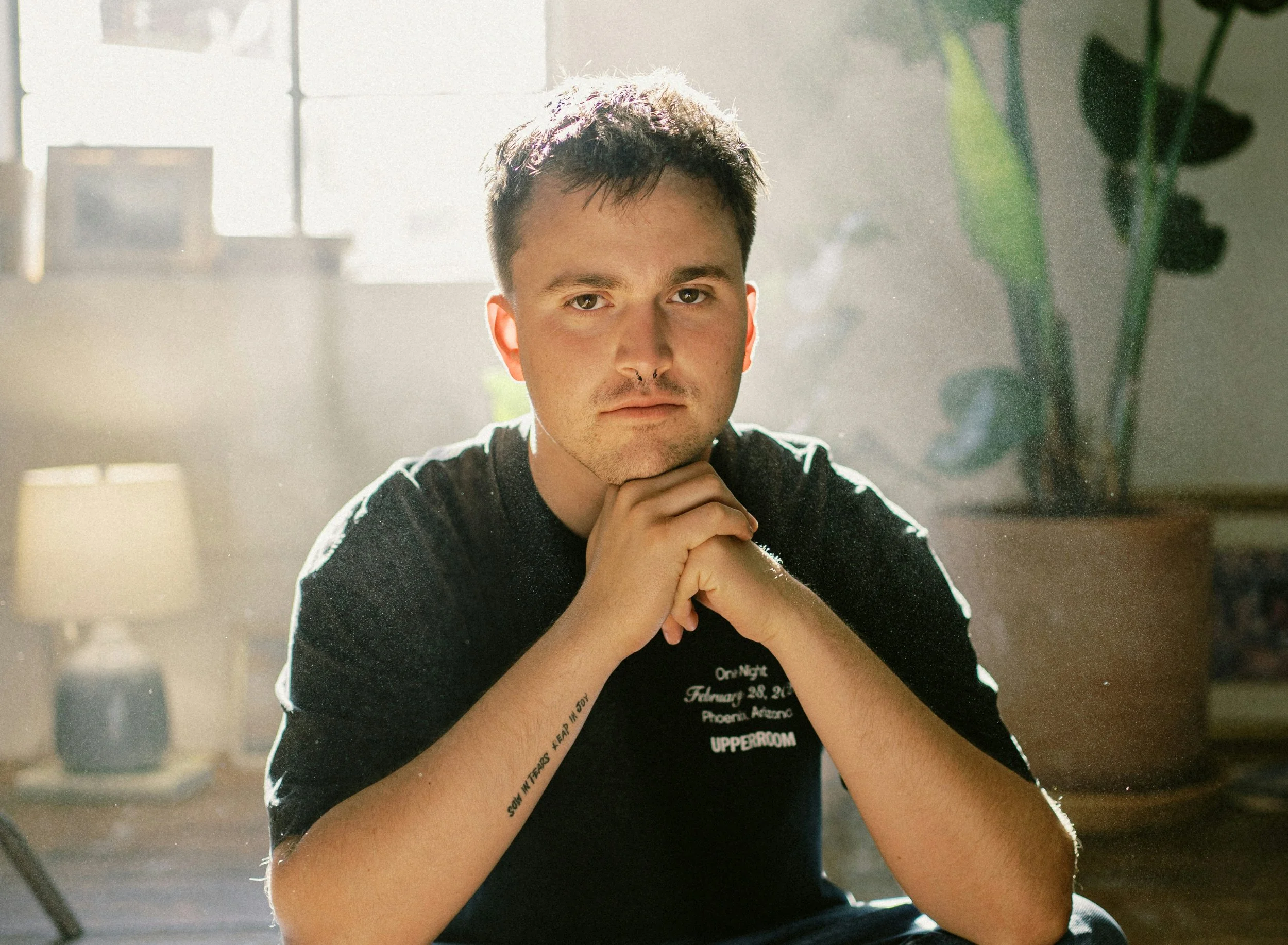 A person reflecting quietly in natural light, representing emotional awareness, self-reflection, and the therapeutic process of identifying and understanding emotions.