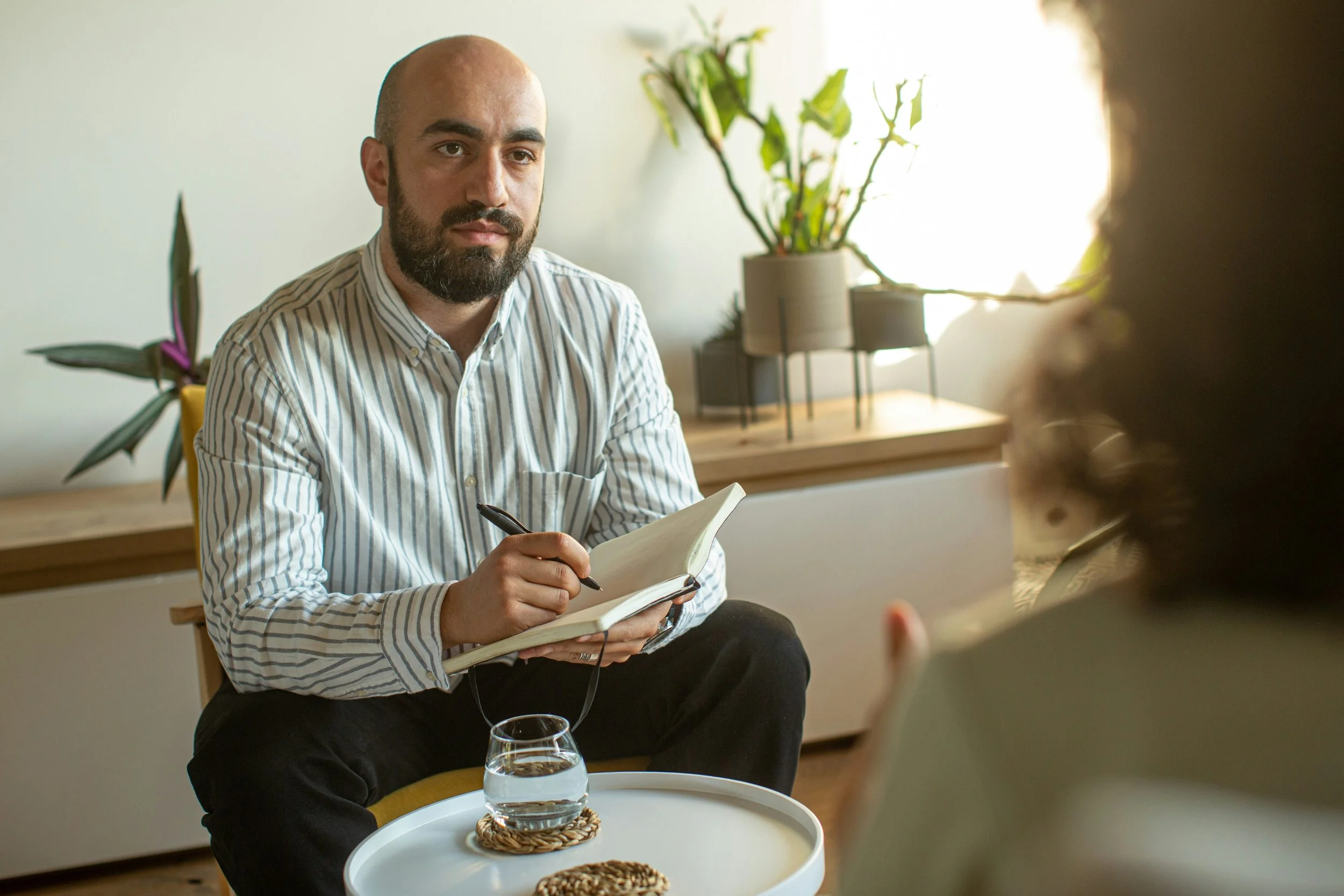 Therapist having thoughtful conversation with client about race and identity