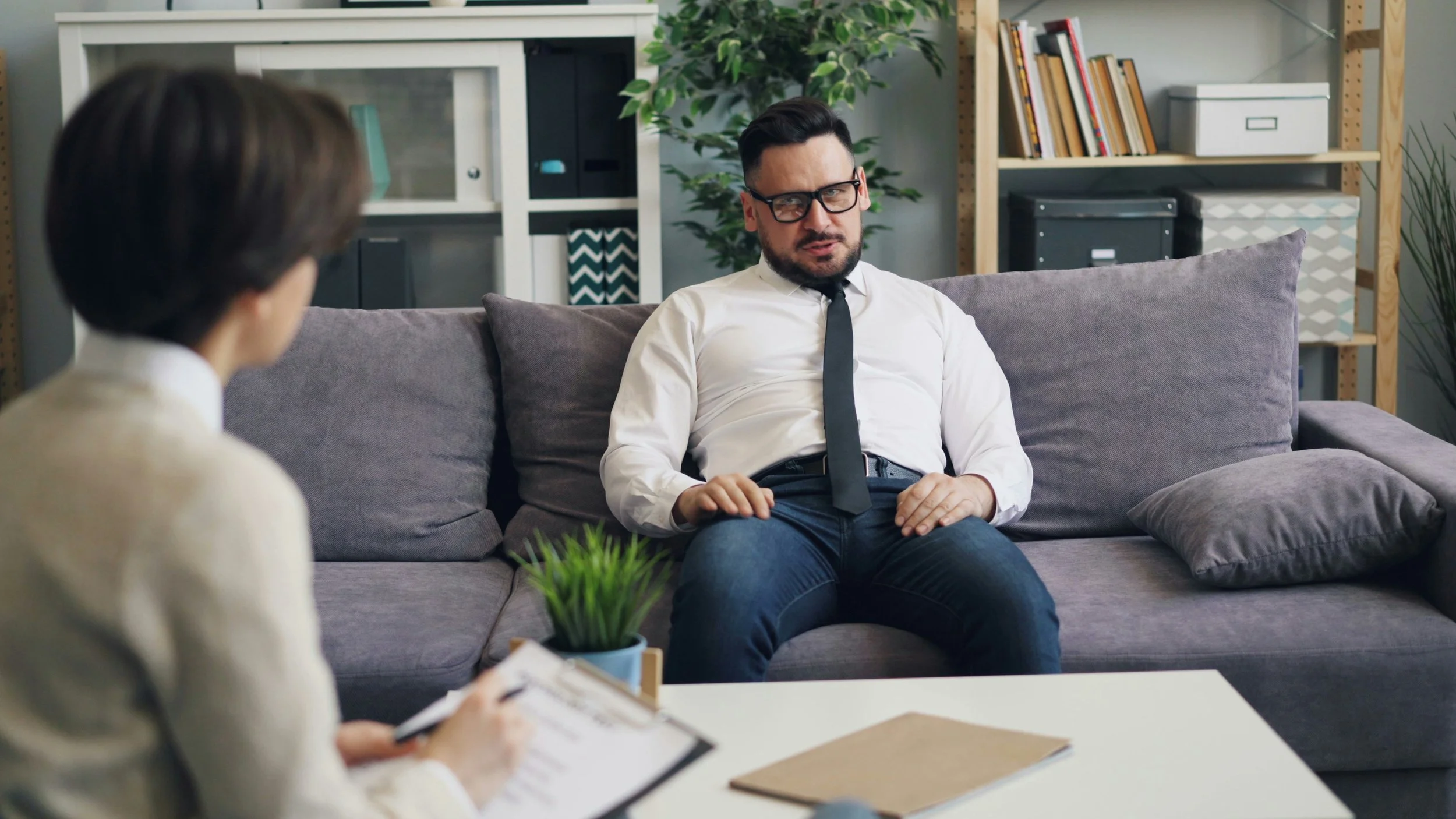 Therapist sitting with a client during a counseling session, representing the challenges of navigating a difficult therapeutic relationship.