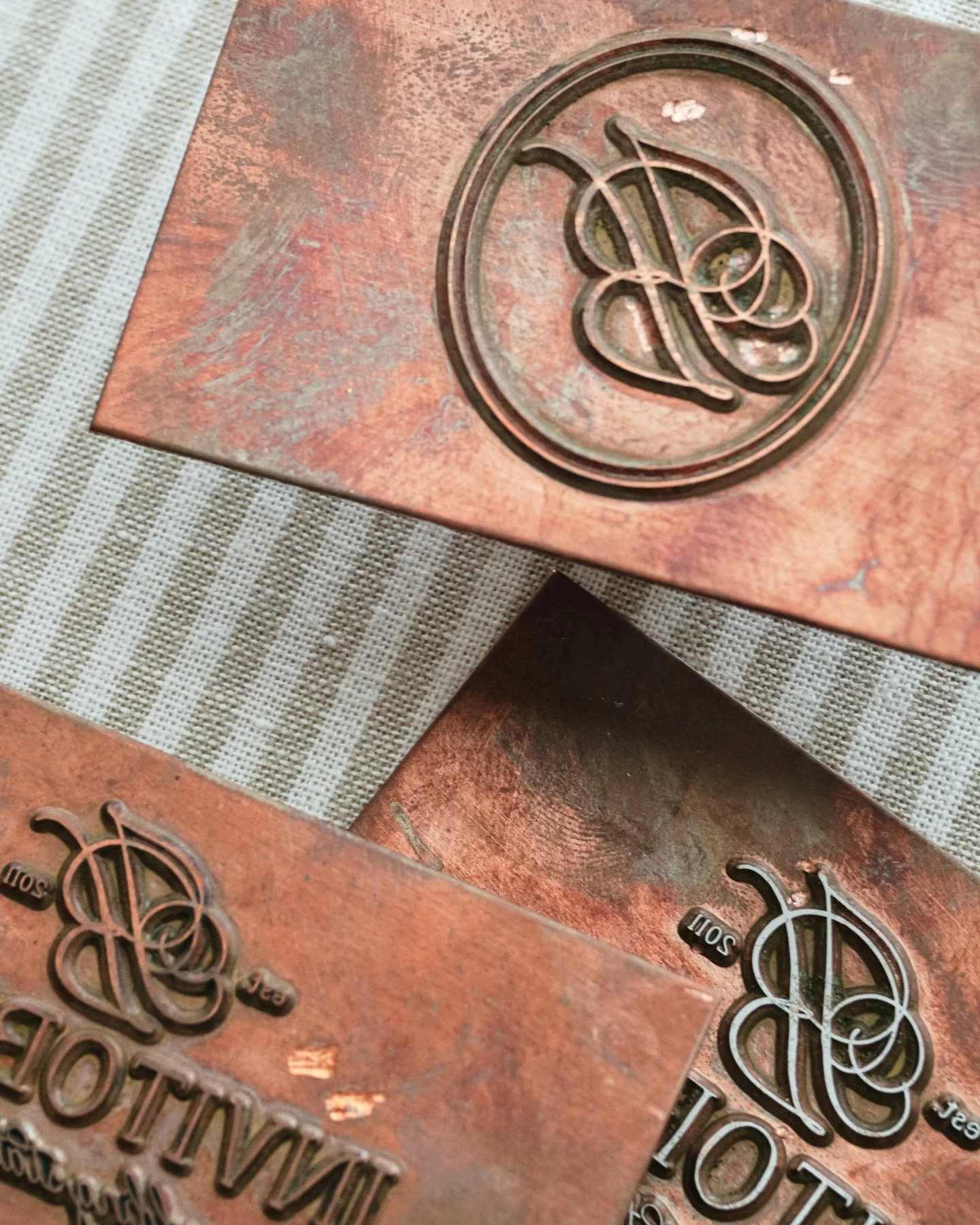 Before the shimmer, there&rsquo;s the copper.

Every foil design we create begins as a plate like these, etched in reverse so the artwork reads perfectly once it meets the paper. Under heat and pressure, the plate presses a thin layer of foil into th