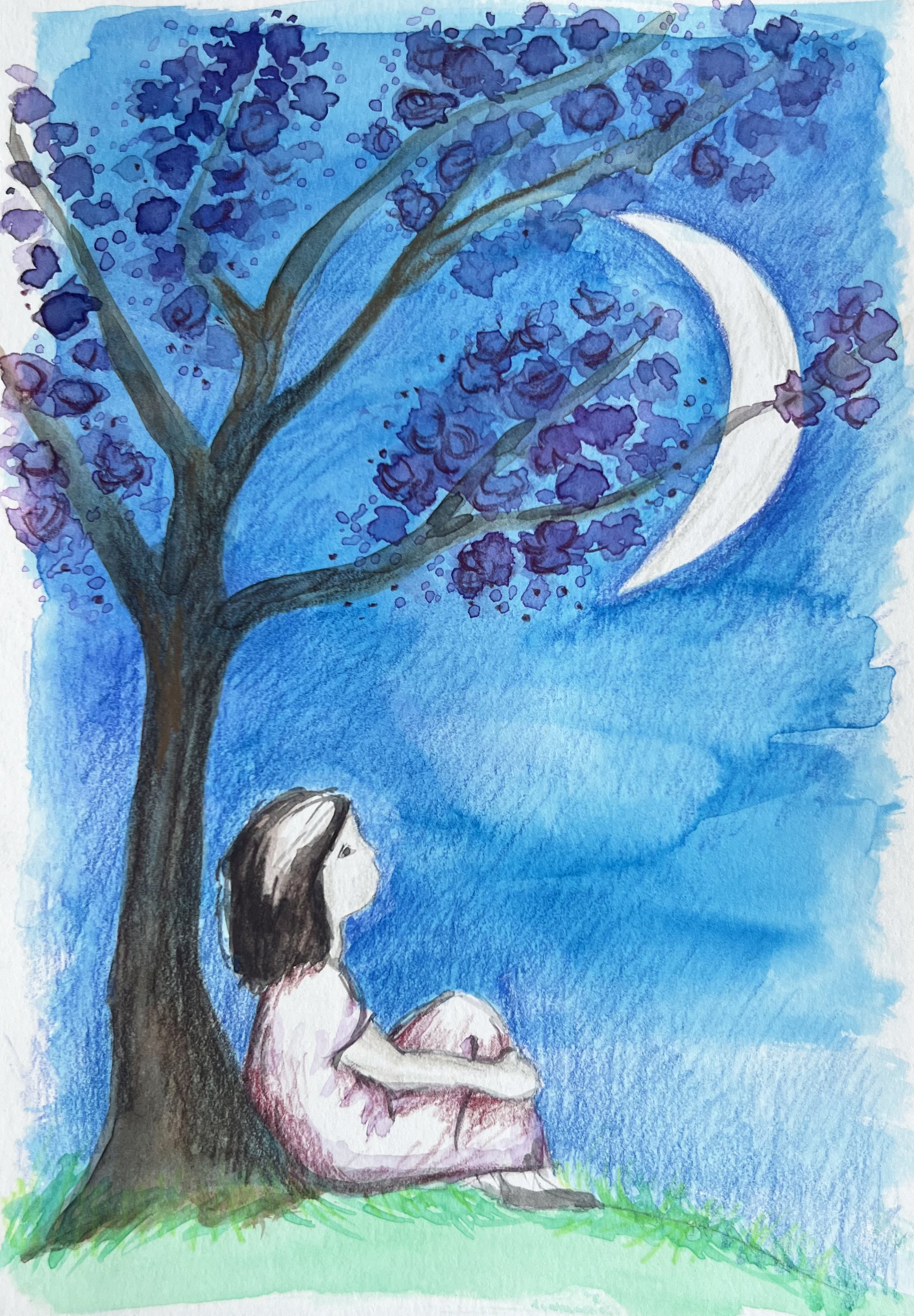 Girl sitting under a tree