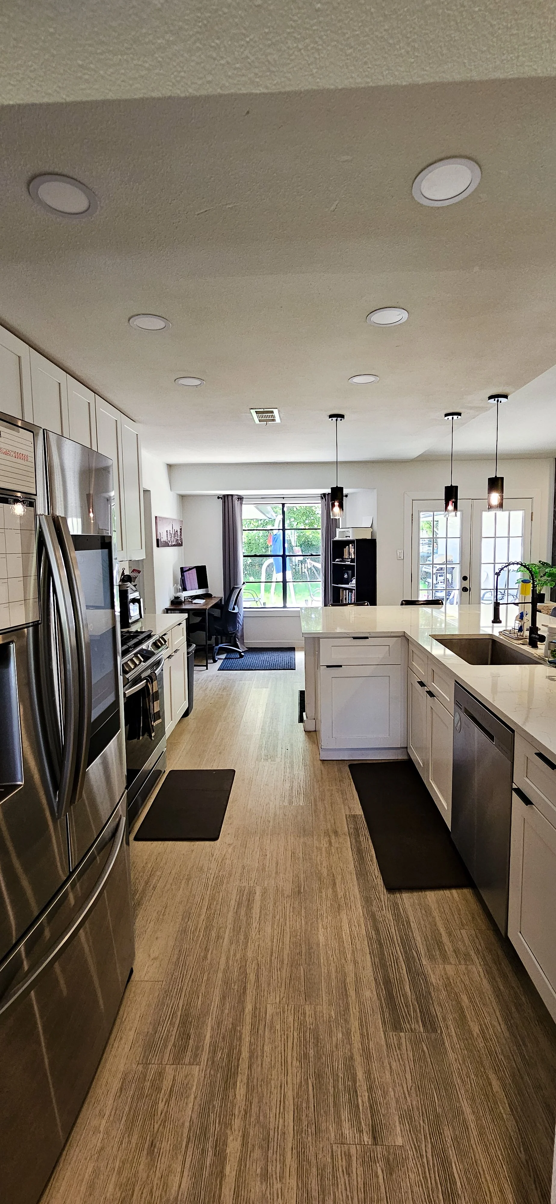 House 1 kitchen with smart fridge and oven with built in air fryer