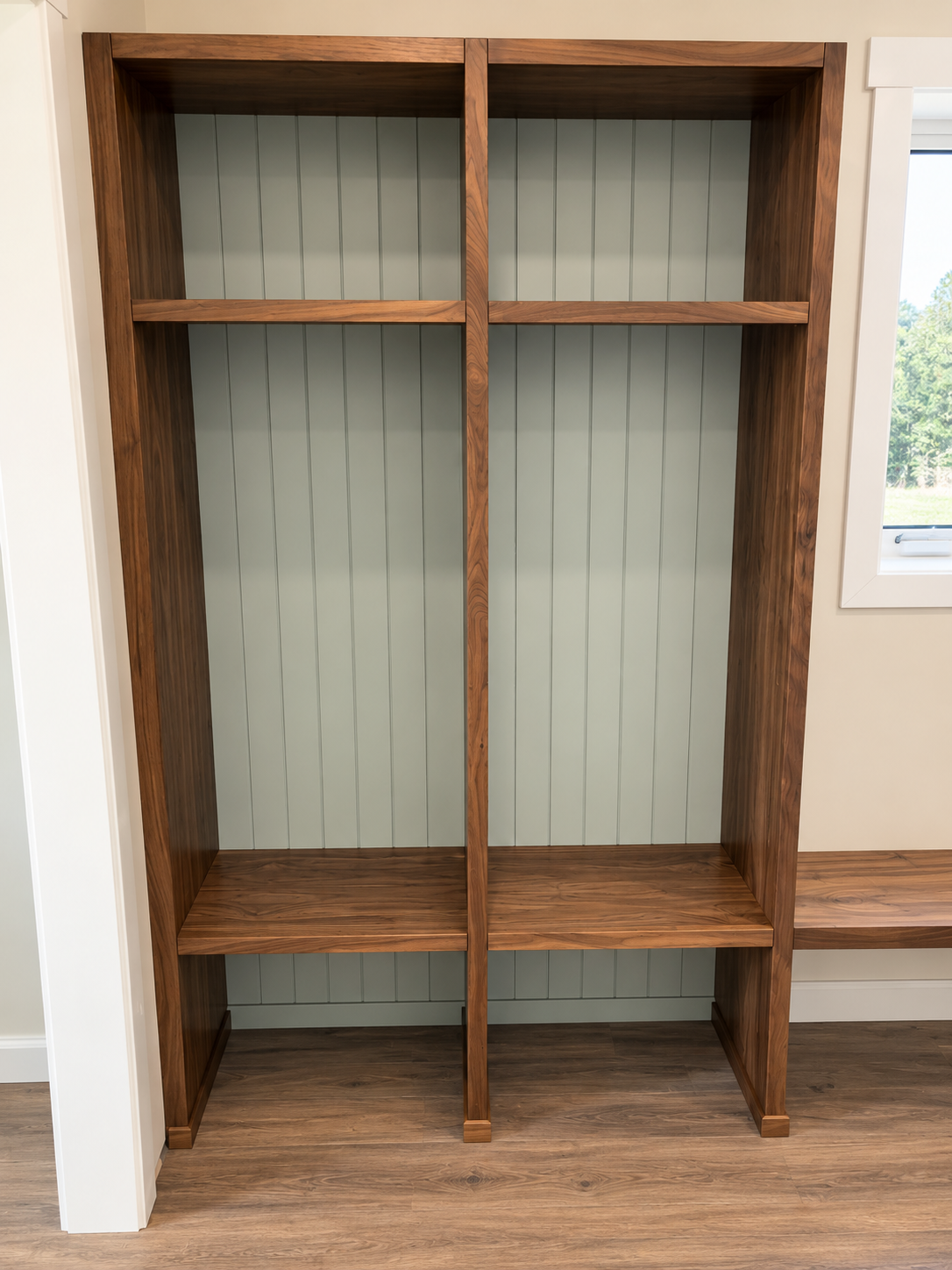 Custom wood mudroom locker with open shelving, vertical dividers and built-in bench storage.