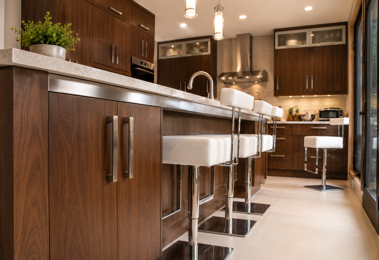 Modern kitchen with dark wood kitchen cabinetry and island with detailed wood grain and integrated storage by Winters Woodworks.