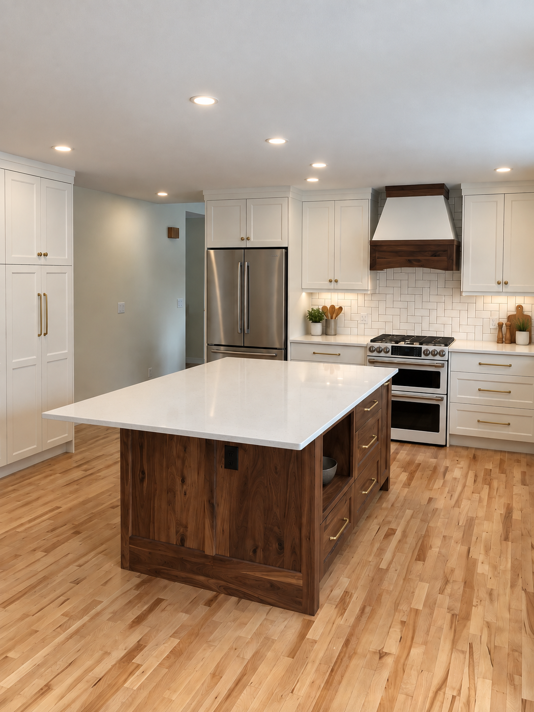 Custom white kitchen with natural wood island, handcrafted range hood and floor-to-ceiling cabinetry by Winters Woodworks.