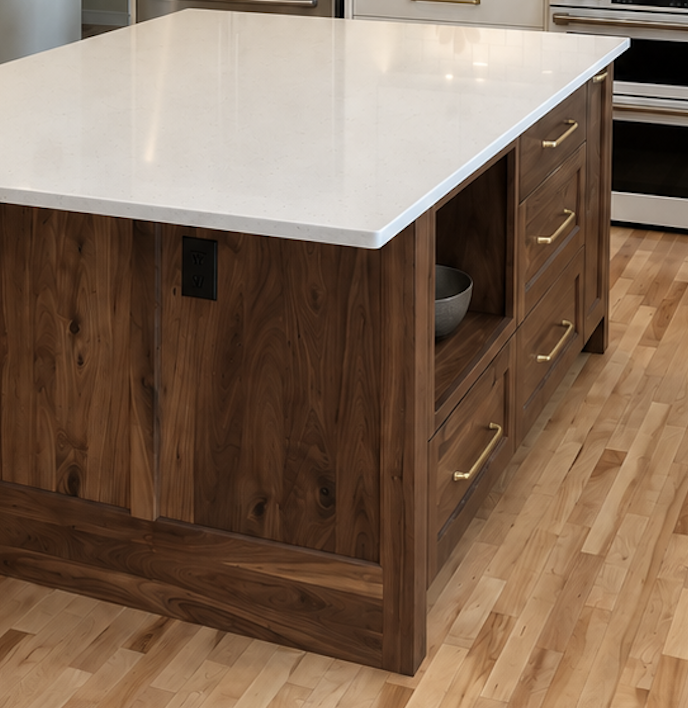 Custom walnut kitchen island with detailed wood grain, brass hardware and white quartz countertop.