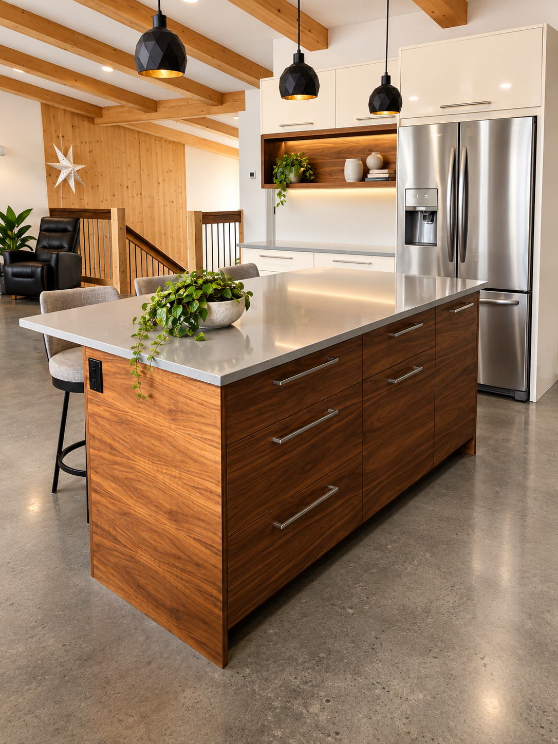 Custom walnut upper cabinetry with integrated range hood, white countertop and modern stainless steel finishes.