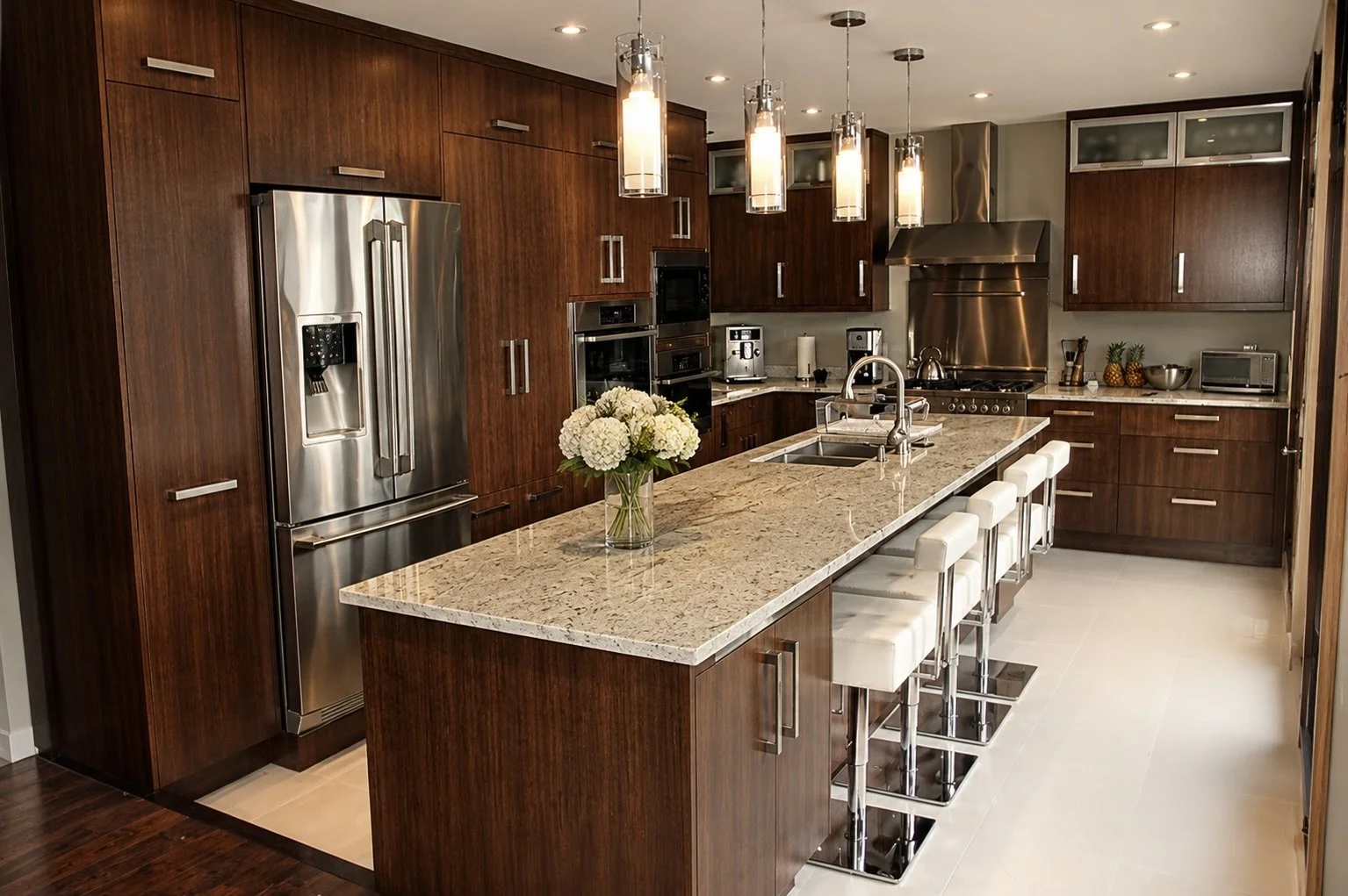Modern kitchen Custom kitchen with rich wood cabinetry, large stone island and handcrafted storage by Winters Woodworks.