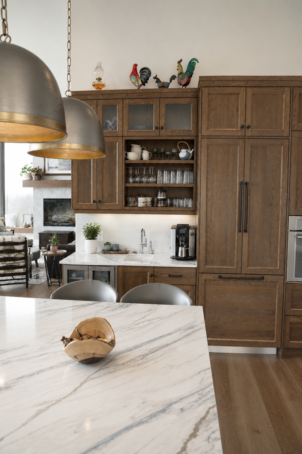 Custom natural wood kitchen cabinetry with open shelving, integrated storage and white stone countertops.