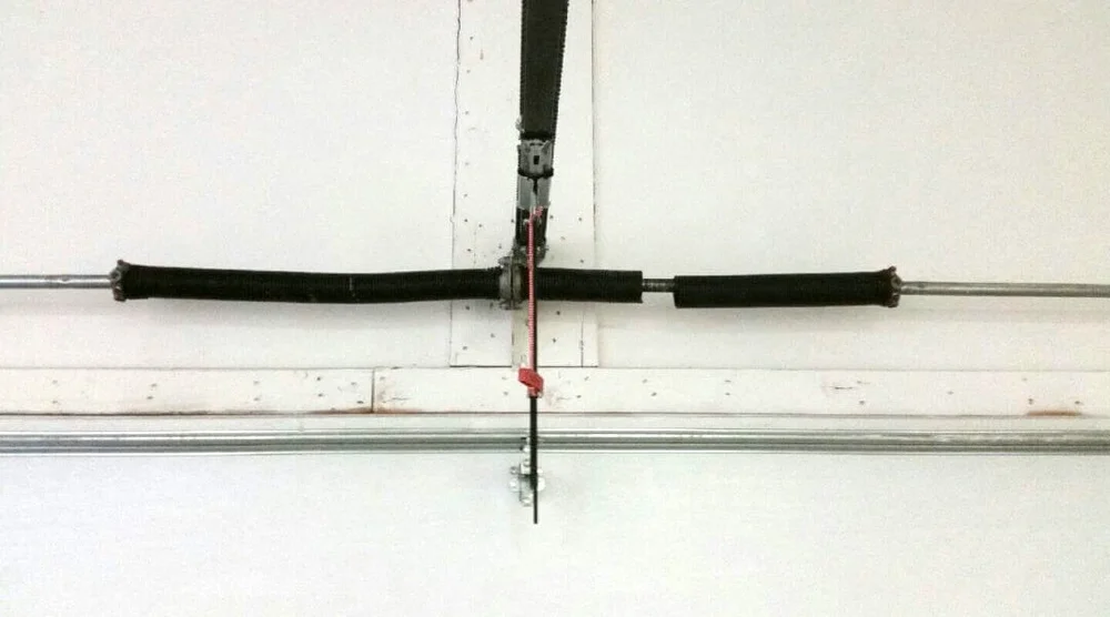 Broken torsion spring on a garage door shaft