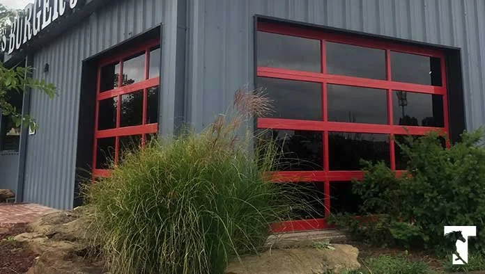 Full-view glass aluminum overhead doors on a commercial building