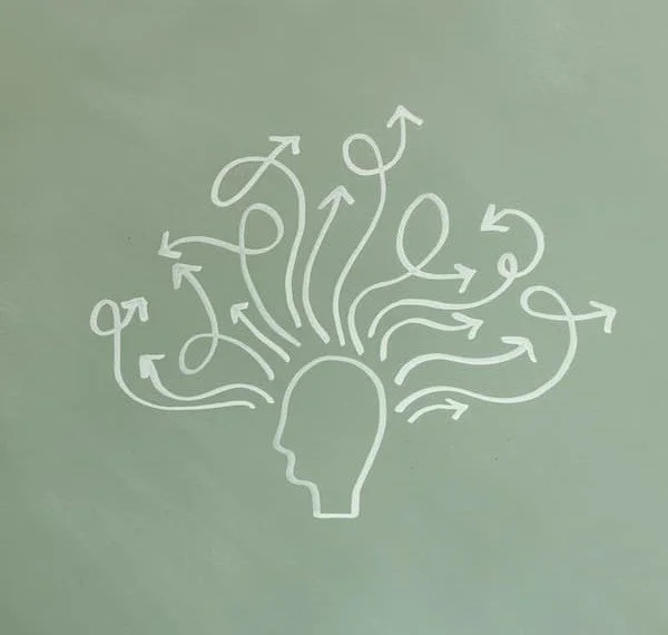 drawing of a person's head with several lines coming out indicating thoughts