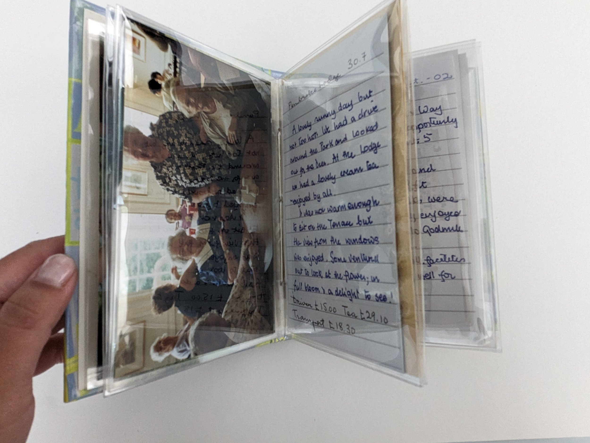 Archival housing of a photo album with degrading plasticizer
