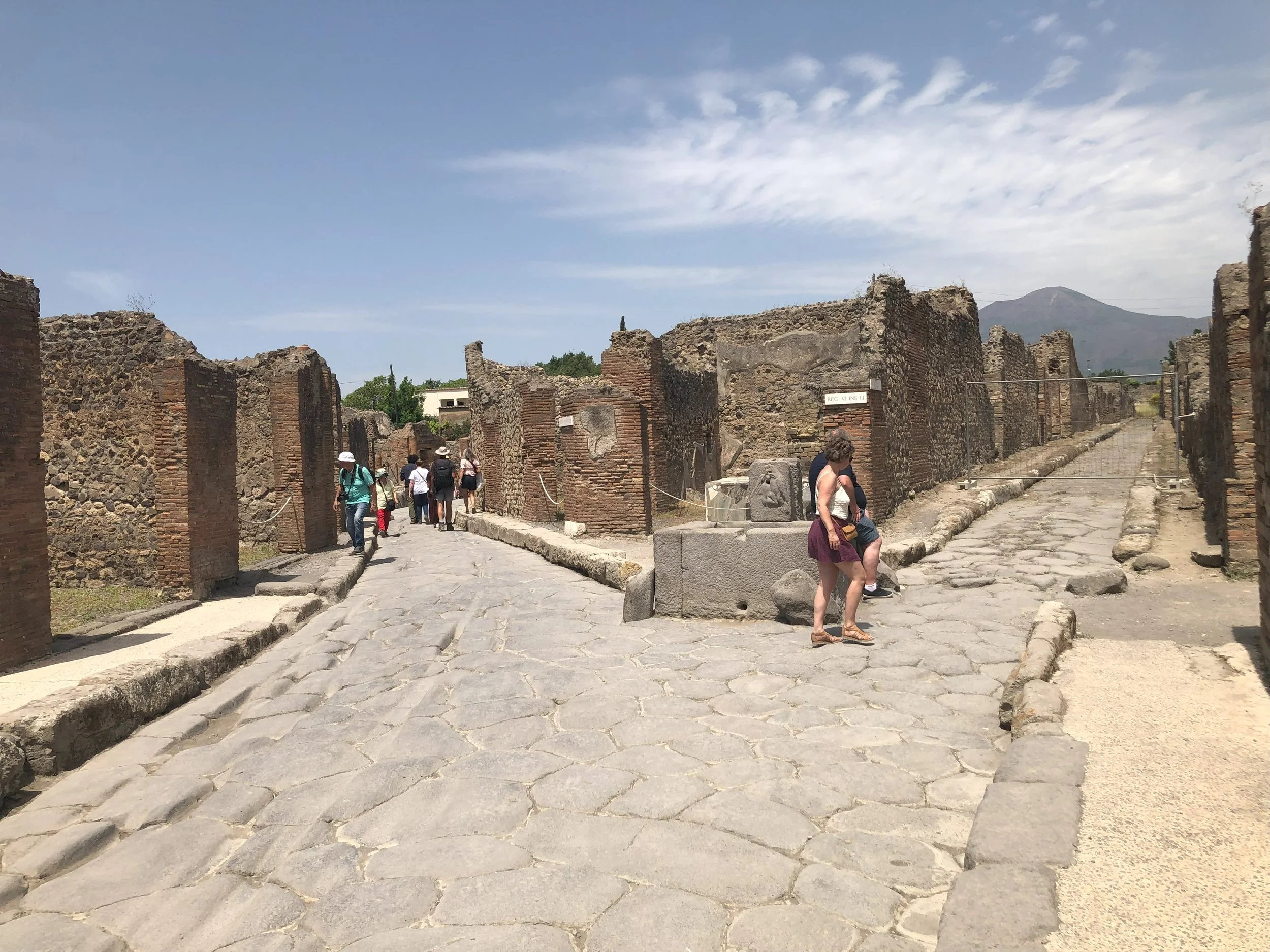 Ancient city ruins under a clear blue sky, symbolizing the rich history and foundation upon which G Group builds its collaborative community of experienced professionals.
