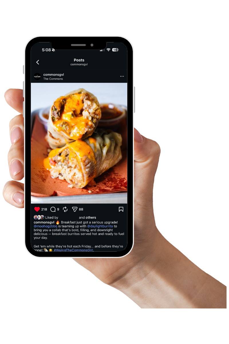 Close-up of a phone screen showcasing social media management and food photography in Greenville, SC that is showing a social media post with a photo of breakfast burritos, with melted cheese and filling visible, on a plate.
