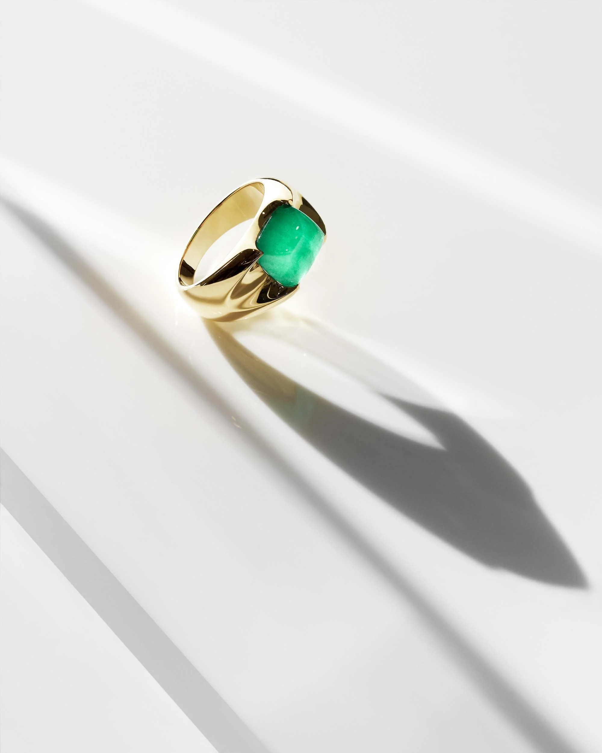 Liv Luttrell Spear Tip Ring. Yellow gold with natural sugarloaf emerald cabochon, high polish finish.