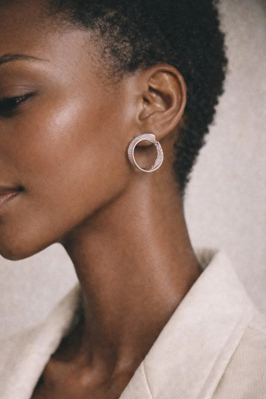 Twist hoop earrings white gold .jpg