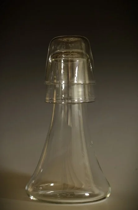 clear glass hand blown decanter with stackable cups that are also the lid