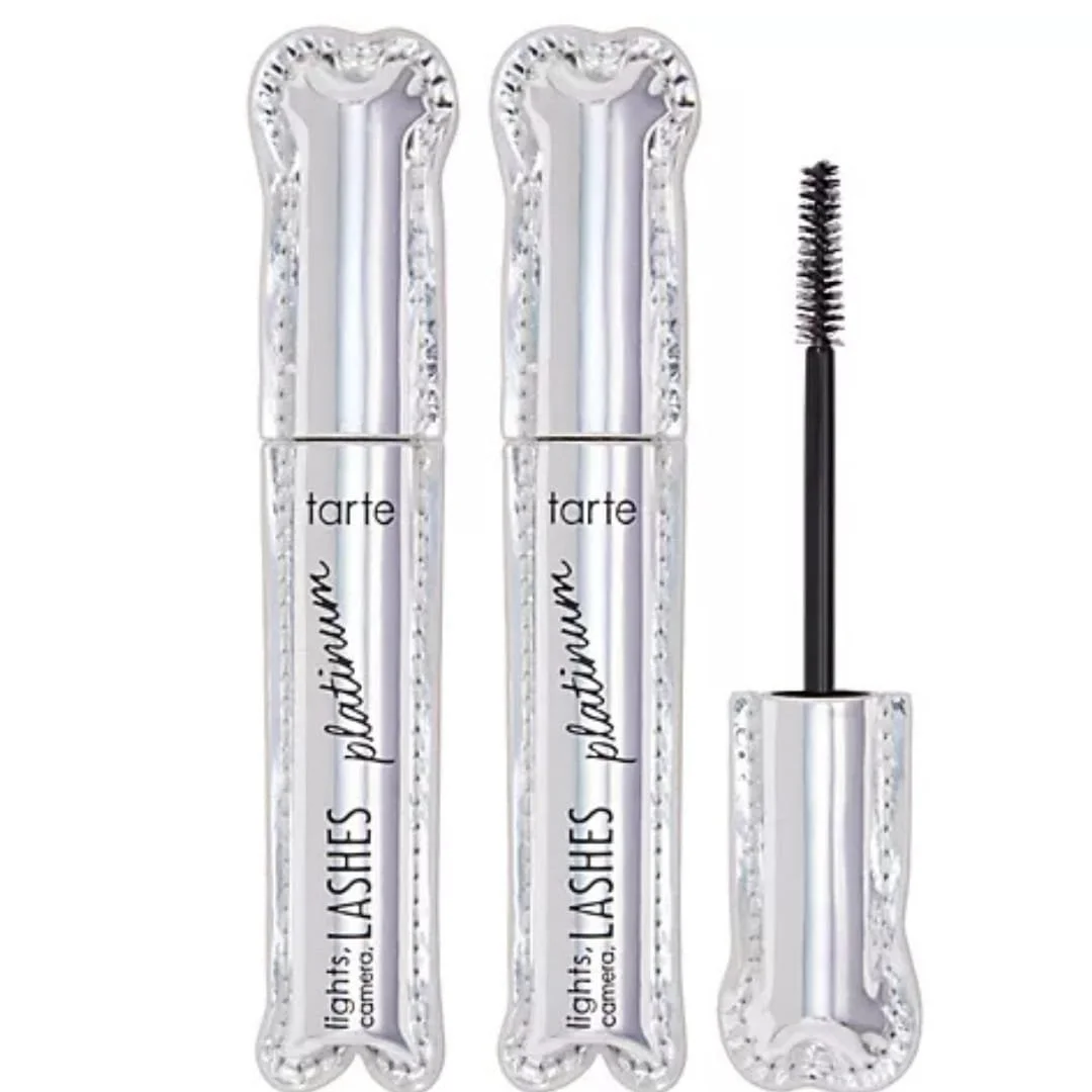 Tarte Lights, Camera, Lashes Platinum Mascara featuring metallic silver tubes with ornate caps, shown with one open tube displaying the mascara wand on a white background.