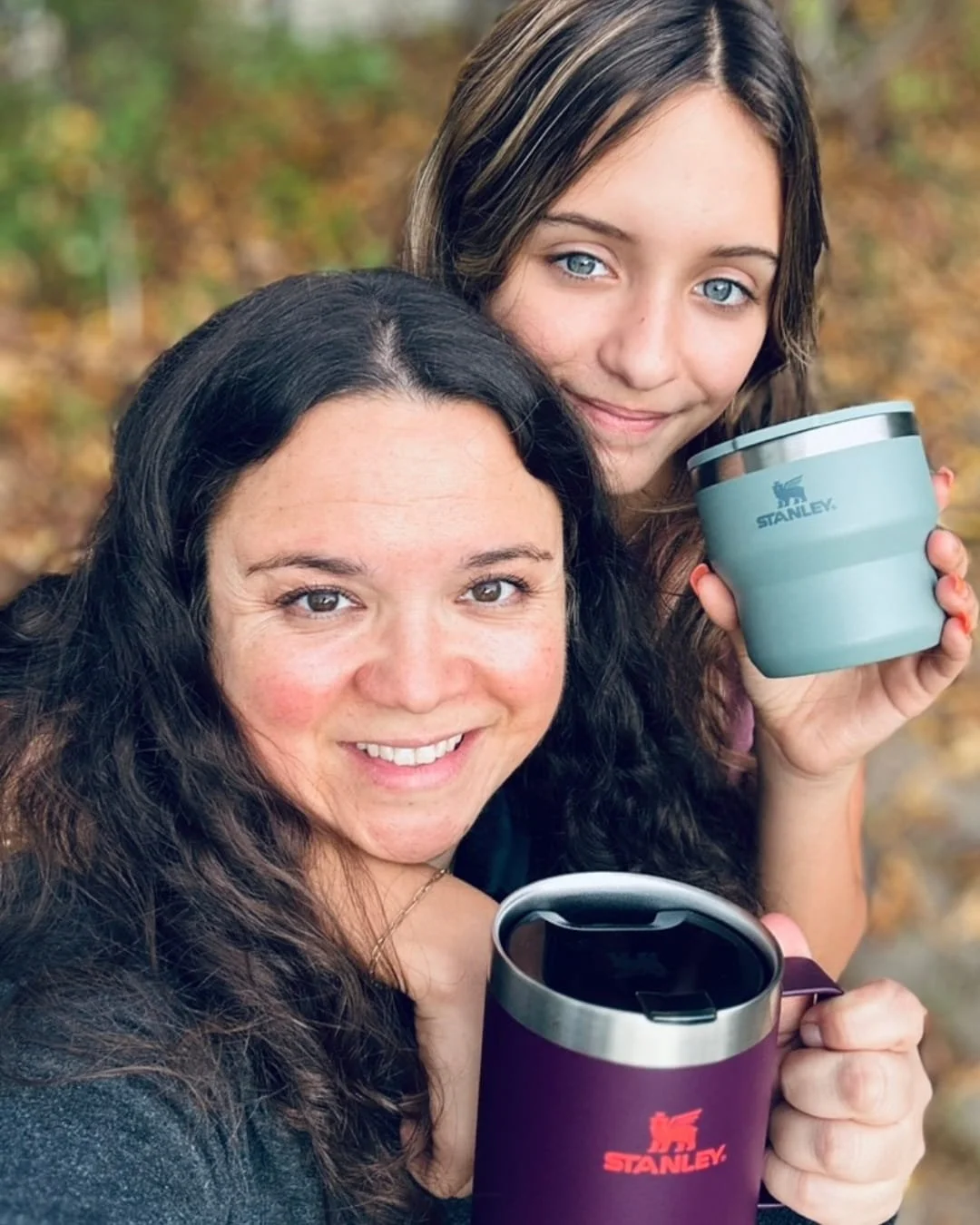 Stanley Camp Mug with handle held outdoors in a lifestyle photo