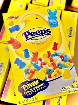 Bright yellow Kellogg's Peeps cereal box featuring a large Peeps chick, colorful marshmallow-flavored cereal with chick and bunny-shaped marshmallows, and Limited Edition branding.