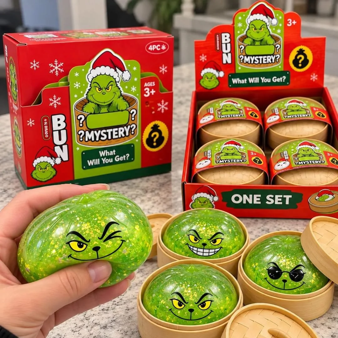 Hand squeezing a green dumpling squishy toy beside a holiday dumpling squishy mystery box display with bamboo baskets