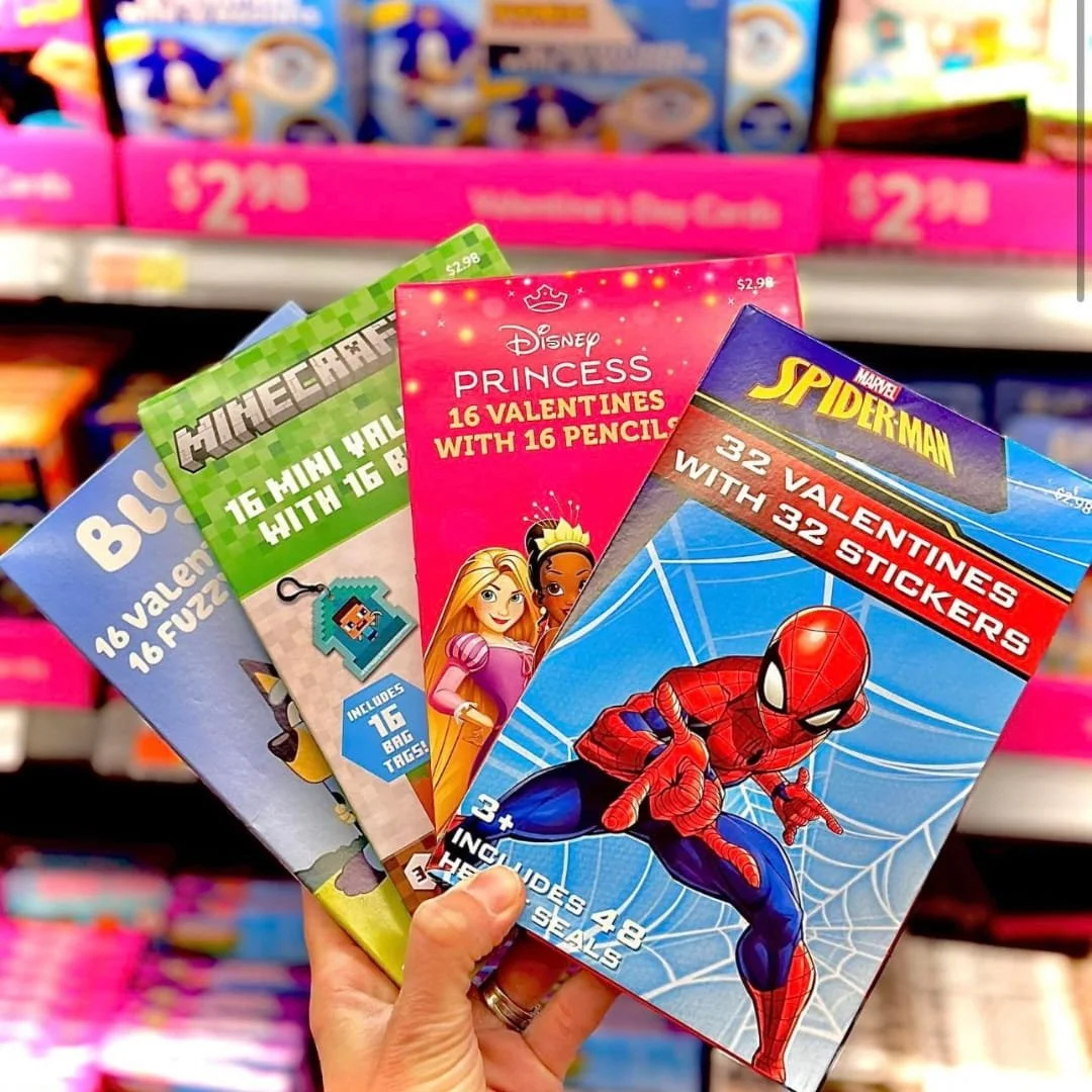 A selection of kids' Valentine's Day cards featuring popular characters like Bluey, Minecraft, Disney Princess, and Marvel Spider-Man. Each set includes themed valentines with fun extras like pencils, stickers, or bag tags, perfect for classroom exch