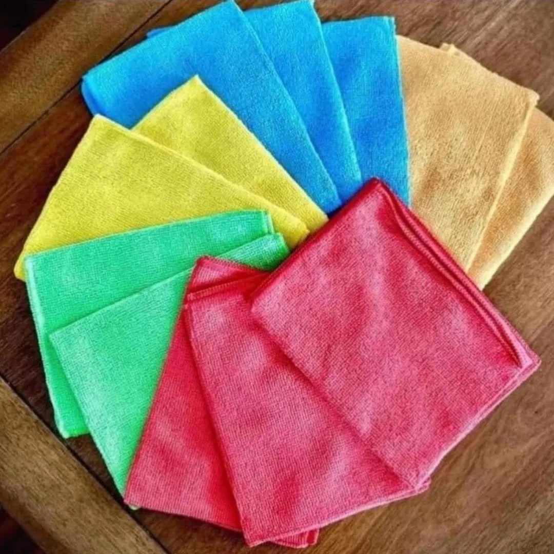 HOMEXCEL microfiber cleaning cloths in vibrant colors including blue, yellow, green, red, and beige, fanned out on